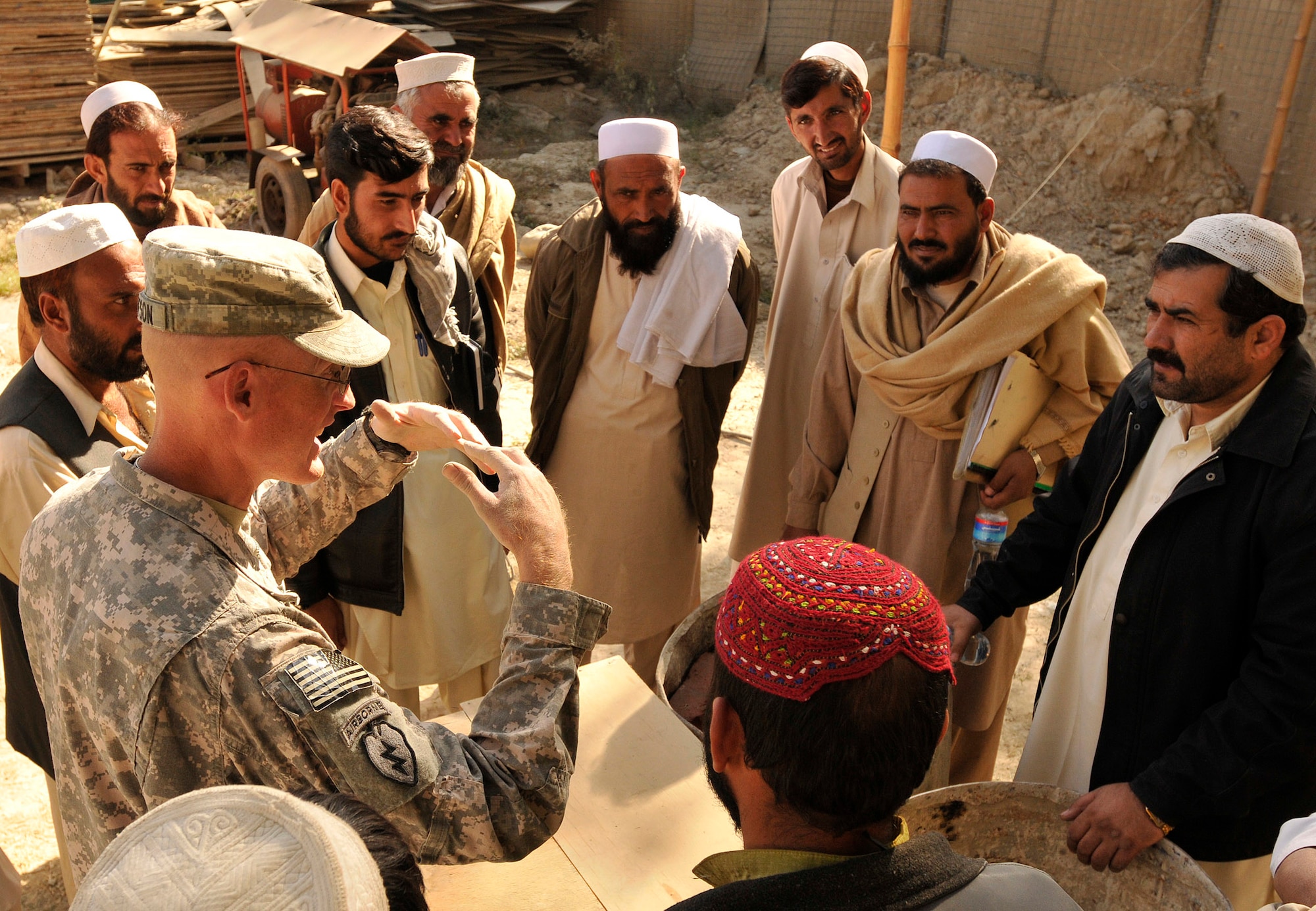 KHOST PROVINCE, Afghanistan - U.S. Navy Lt. Stephen J. Gustafson, Khost Provincial Reconstruction Team engineer, teaches proper masonry supply storage to local engineers, construction contractors, and foremen during a monthly contractor training session held at the Civil Military Operations Center, Khost, Afghanistan recently. Engineers from the Khost PRT provided construction quality assurance training to locals in order to facilitate high quality construction practices in the region. (U.S. Air Force photo/Staff Sgt. Stephen J. Otero)