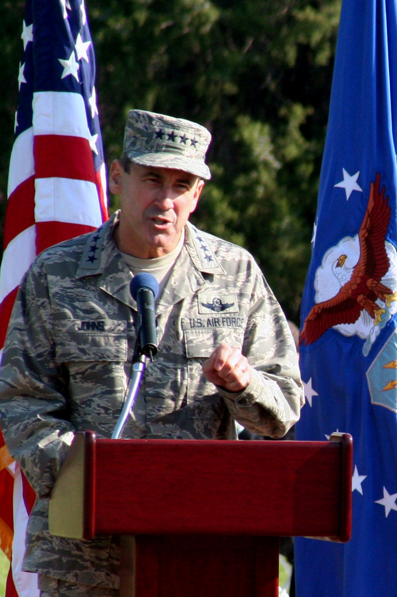 Gen. Raymond E. Johns Jr., Air Mobility Command commander, makes his first speech as commander during the AMC change of command ceremony on Nov. 20, 2009, at Scott Air Force Base, Ill.  General Johns assumed command from Gen. Arthur J. Lichte who retired with 38 years of service during the ceremony.  (U.S. Air Force Photo/Tech. Sgt. Scott T. Sturkol)