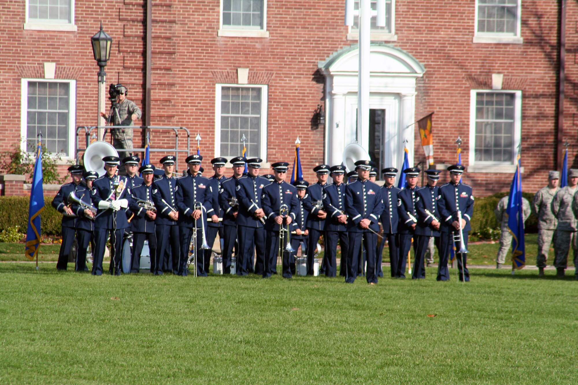 Members of the U.S. Air Force Band of Mid-America stand in formation during the Air Mobility Command change of command ceremony on Nov. 20, 2009, at Scott Air Force Base, Ill. The band played all the music related to the ceremony as Gen. Raymond E. Johns took command of AMC in the ceremony.  (U.S. Air Force Photo/Tech. Sgt. Scott T. Sturkol)