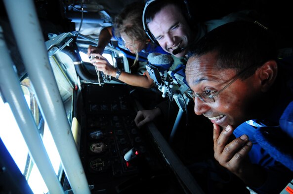 ANDERSEN AIR FORCE BASE, Guam - Senior Airman Matt Oberlin enjoys a moment with an employer over the Pacific Ocean, Nov. 13 during the 624th Regional Support Group Employer Support Flight. Twenty-five local civilian employers of Air Force Reserve members assigned to the 44th Aerial Port Squadron and the 724th Aeromedical Staging Flight, here, participated in a employer appreciation flight aboard a KC-135 Stratotanker. (U.S. Air Force photo by Airman 1st Class Courtney Witt)
