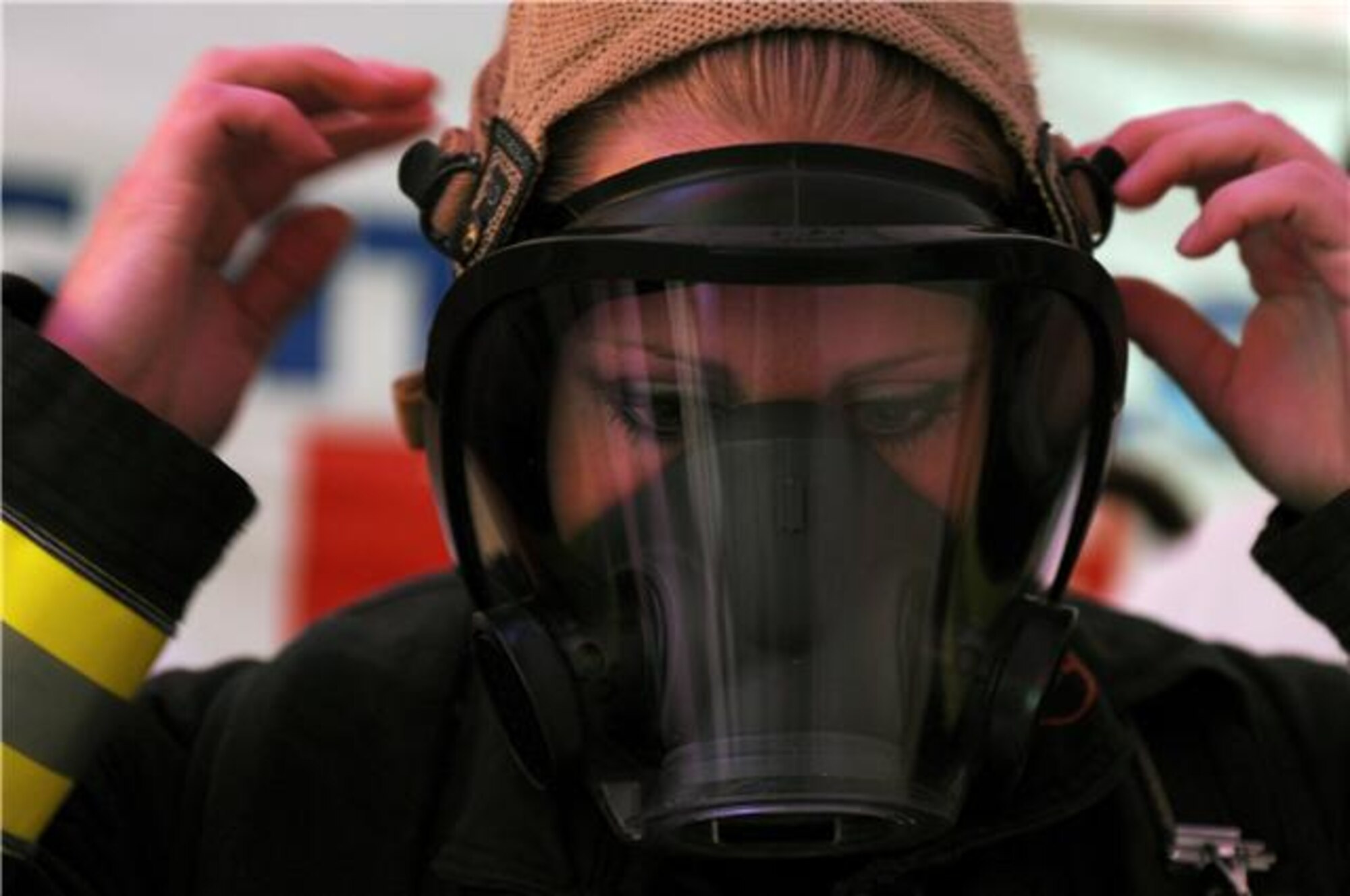 Staff Sgt. Jessica Packard puts on her oxygen mask as she gets ready to compete in the individual relay event Nov. 19, 2009, at the Scott Firefighter Combat Challenge in Las Vegas. Sergeant Packard took 3rd place overall in the female individual competition. She is stationed at Goodfellow Air Force Base, Texas. (U.S. Air Force photo/Staff Sgt. Desiree N. Palacios)