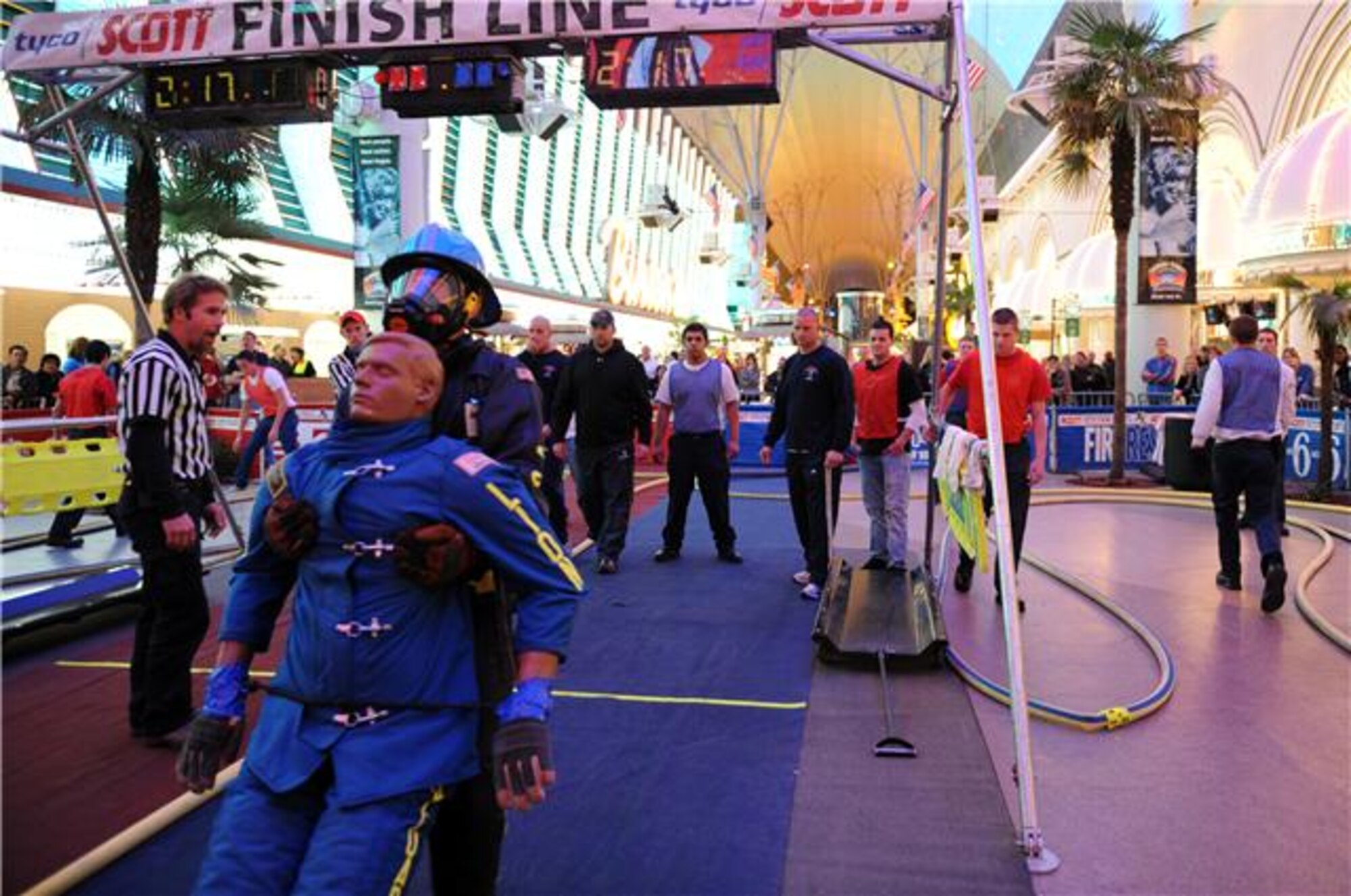 Dave Chiodo "rescues" a life-sized 175-pound "victim” as he competes in the individual relay event Nov. 19, 2009, at the Scott Firefighter Combat Challenge in Las Vegas. Mr. Chiodo is a firefighter at Travis Air Force Base, Calif. (U.S. Air Force photo/Staff Sgt. Desiree N. Palacios)