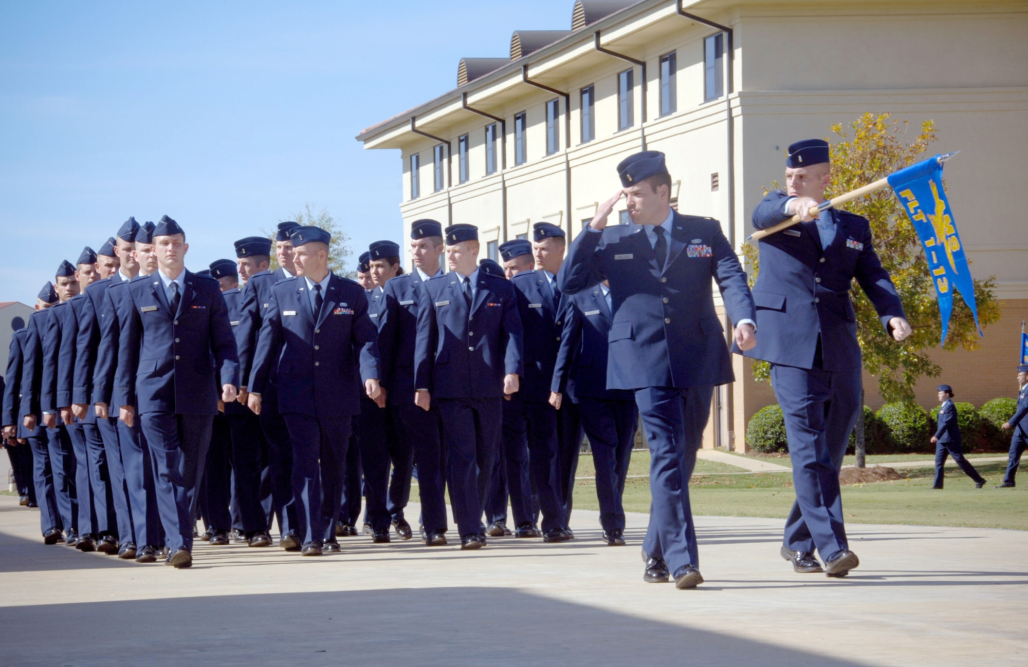 New Air National Guard second lieutenants pass in review in their graduation parade Nov. 13, 2009 at Maxwell Air Force Base, Ala. The Guard officers are part of the first class to graduate from the newly formed Det. 12 since the Academy of Military Sciences moved in October to the Maxwell AFB Officer Training School from McGhee Tyson Air National Guard Base, Tenn. (U.S. Air Force photo/Melanie Rodgers Cox)