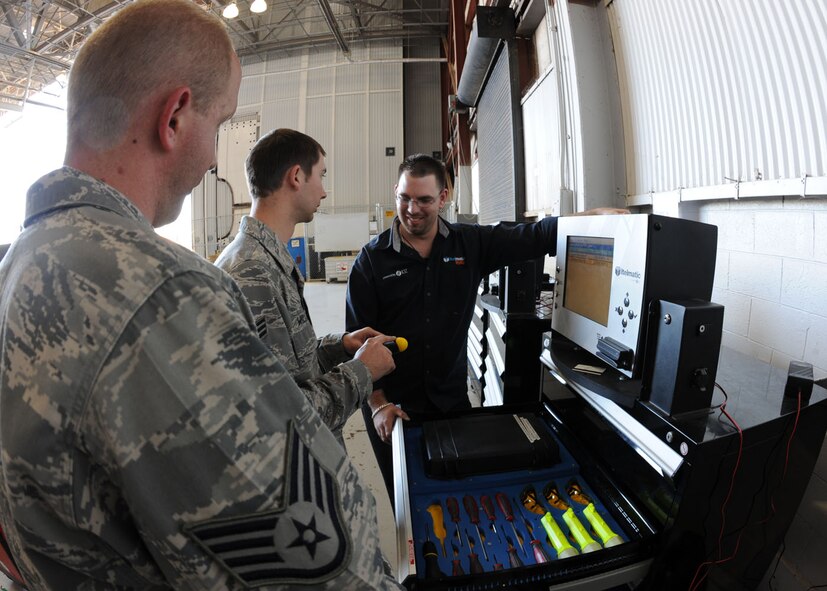 DYESS AIR FORCE BASE, Texas – Senior Airman Drew Williams and Staff Sgt. Larry Walders, 317th Maintenance Squadron crew chiefs, train on new electronic toolboxes with Jay Mullis, IDZ Technologies, here Nov. 19. The new electronic toolboxes were first introduced 3 years ago and are designed for specialty tools. Airmen will sign out tools by swiping their Common Access Card, which will help prevent the loss of tools and reduce FOD. Dyess purchased 11 new toolboxes since 2008 and plans to purchase 14 more in the future. These toolboxes save 25 man-hours a day, and $35 per man-hour per toolbox. (U.S. Air Force photo by Senior Airman Jennifer Romig)