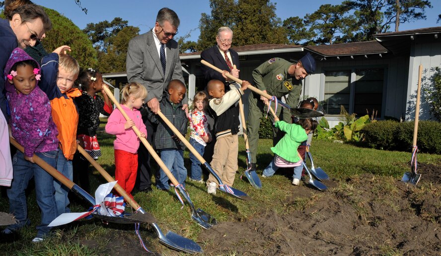 MOODY AIR FORCE BASE, Ga. -- Col. Gary Henderson, 23rd Wing commander, along with local community leaders and children from the Child Development Center celebrate at the ground breaking ceremony for the new CDC facility here Nov 20. The project is scheduled for completion in March 2011. (U.S. Air Force photo by Senior Airman Schelli Jones)