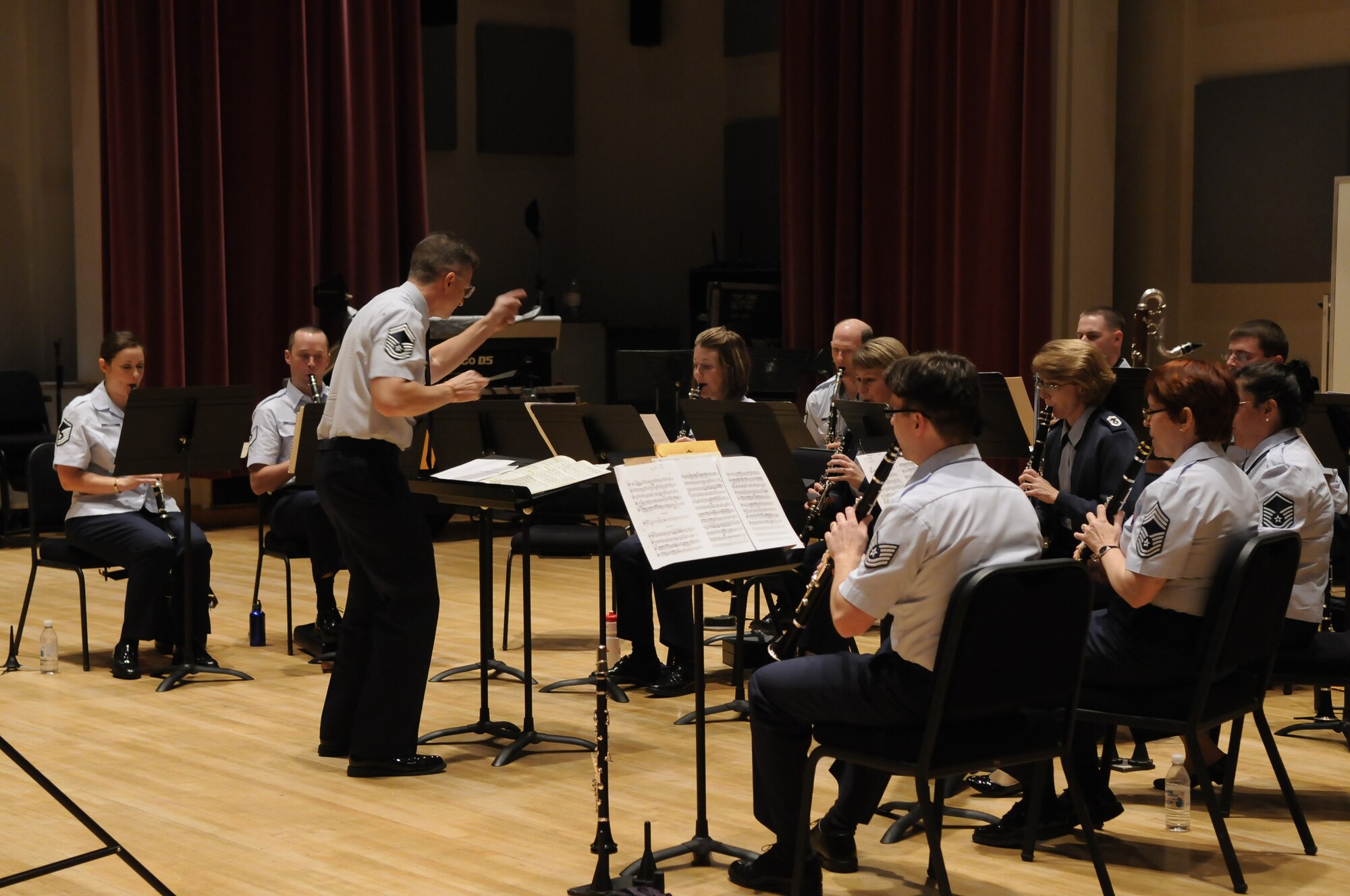 Master Sgt. Carl Long conducts the clarinet section of the Concert Band during the Clarinet Ensemble Festival.  This event brought clarinet ensembles from around the nation together for a weekend of performances and panel discussions. The festival featured many service band ensembles, including clarinet quartets and trios from the U.S. Navy, Marine, and Army Bands.  The event culminated on Sunday, November 8, with a performance by The USAF Band Clarinet Quartet and Clarinet Choir. (U.S. Air Force photo by Senior Airman Alexandre Montes)