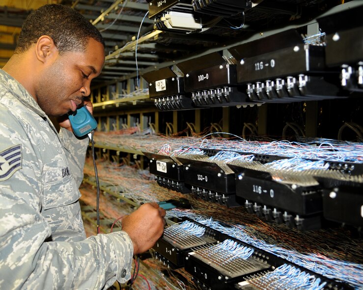 WHITEMAN AIR FORCE BASE, Mo. – Staff Sgt. Nakia Daniel, 509th Communications Squadron commercial communication quality assurance evaluator, checks a phone line Nov. 20. Sergeant Daniel frequently checks the phone lines to make sure the function properly for the base. (U.S. Air Force Photo/ Senior Airman Cory Todd) (Released)