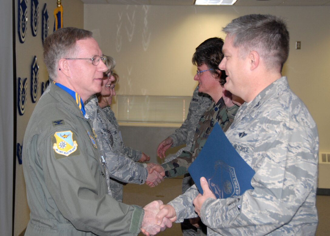 Great Falls, Mont.- (Left to right) Col. Gerald Wiest congratulates the commander of the 120th Medical Group, Col. Mark Snyder, upon the group's completion of a Health Services Inspection.  (USAF photo by Tech. Sgt. Michael Touchette)