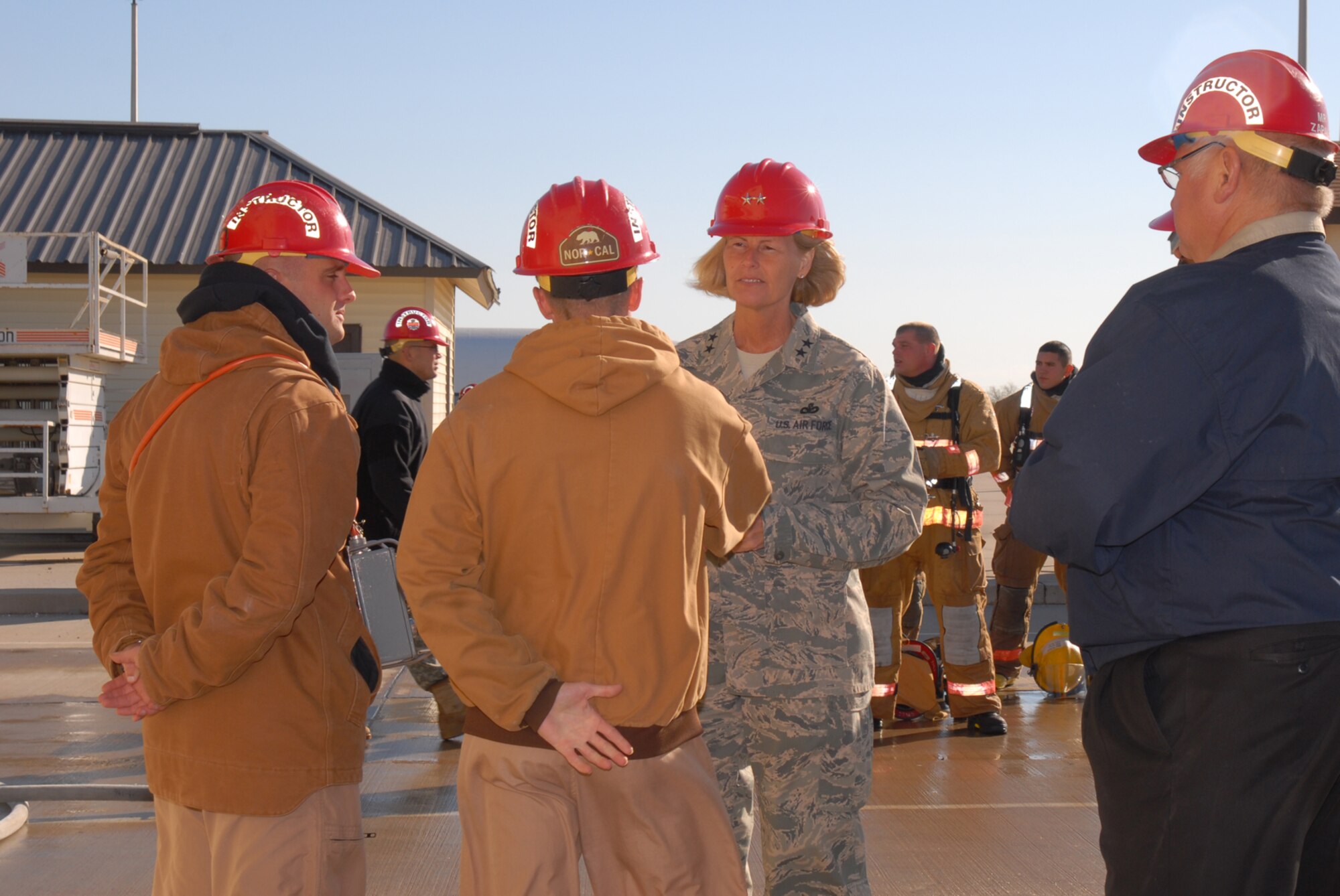 GOODFELLOW AIR FORCE BASE, Texas -- Instructors from the 312th Training Squadron brief Maj. Gen. Mary Kay Hertog, 2nd Air Force commander, on fire training procedures at the Louis F. Garland DOD Fire Academy, Nov. 19, 2009.  This was General Hertog's first visit to Goodfellow since assuming command of the 2nd Air Force in September. (U.S. Air Force photo/Staff Sgt. Laura R. McFarlane) 
