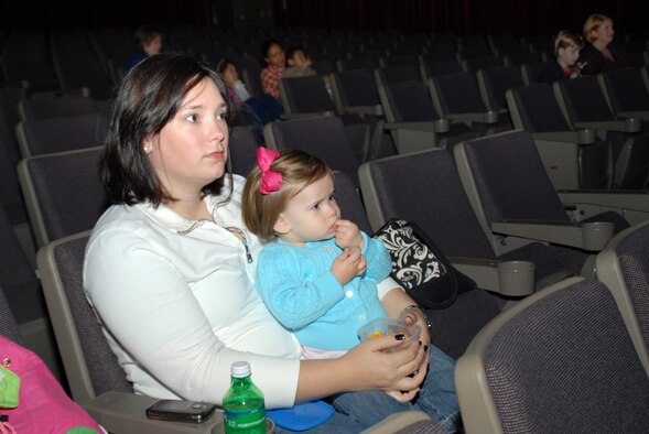 Kristen Boyer and Brooke Boyer attend a special screening of the Disney Pixar film "Finding Nemo" for children with special needs Nov. 14, 2009, at the theaer at Little Rock Air Force Base, Arkr. The event was sponsored by the base's Exceptional Family Member Program. The Boyer's are family members of Tech. Sgt. Casey Boyer, a 19th Logistics Readiness Squadron aerial delivery supervisor. (U.S. Air Force photo/Senior Airman Nathan Allen)