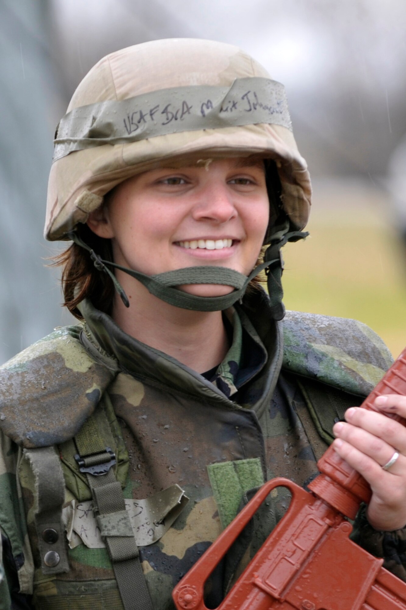 Senior Airman Marit Johnson finds an opportunity to smile while training in the cold rain at McConnell Air Force Base, Kan., on Nov. 15. Airman Marit is assigned to the 931st Aerospace Medicine Flight, an Air Force Reserve unit at McConnell. (U.S. Air Force photo/Master Sgt. Jason Schaap)