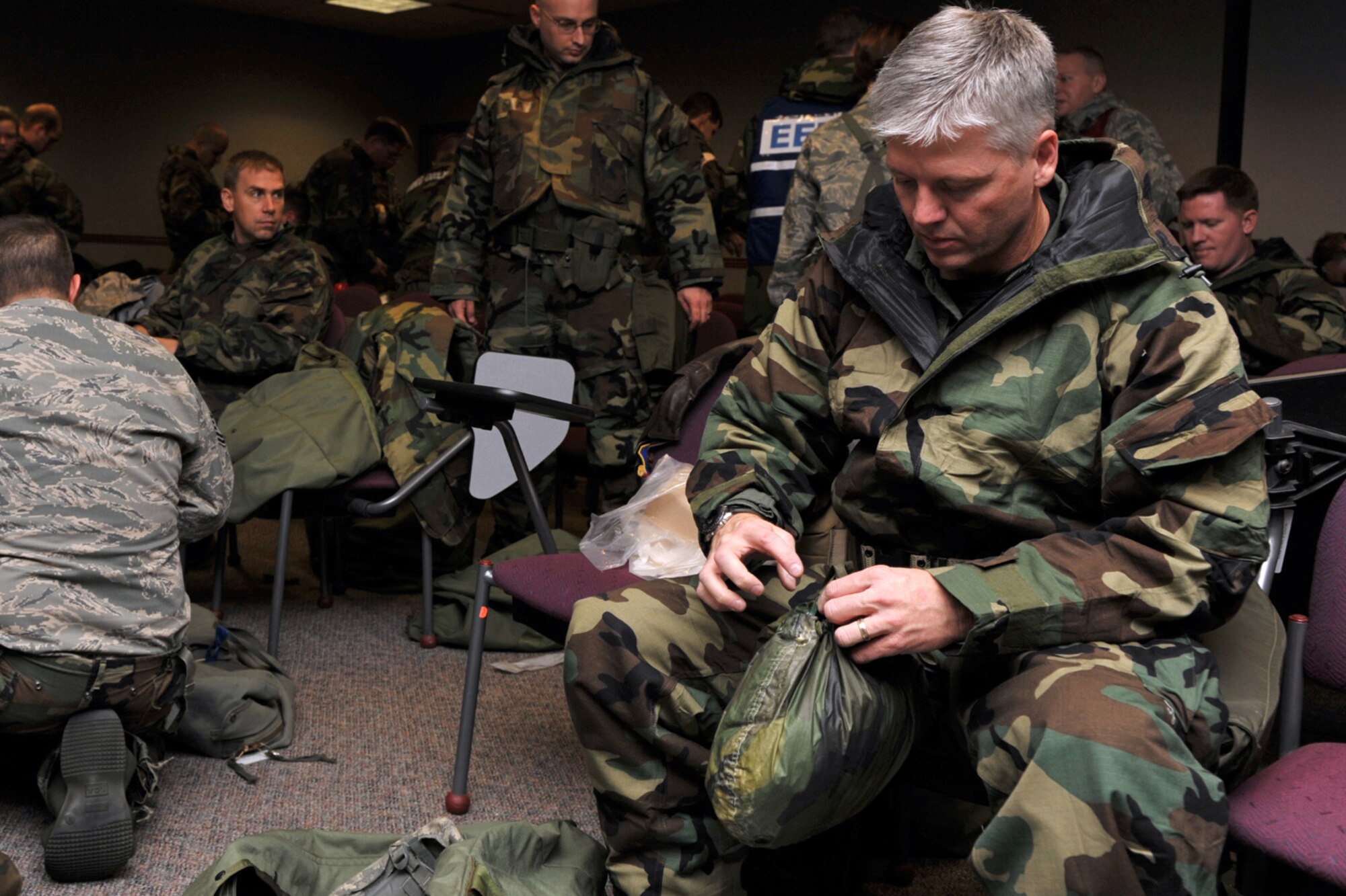 Lt. Col. Barry Jones gets his clothing and equipment ready for Ability-To-Survive-and-Operate training at McConnell Air Force Base, Kan., on Nov. 15. Colonel Jones is commander of the 931st Operations Support Flight, an Air Force Reserve unit at McConnell AFB. (U.S. Air Force photo/Master Sgt. Jason Schaap)