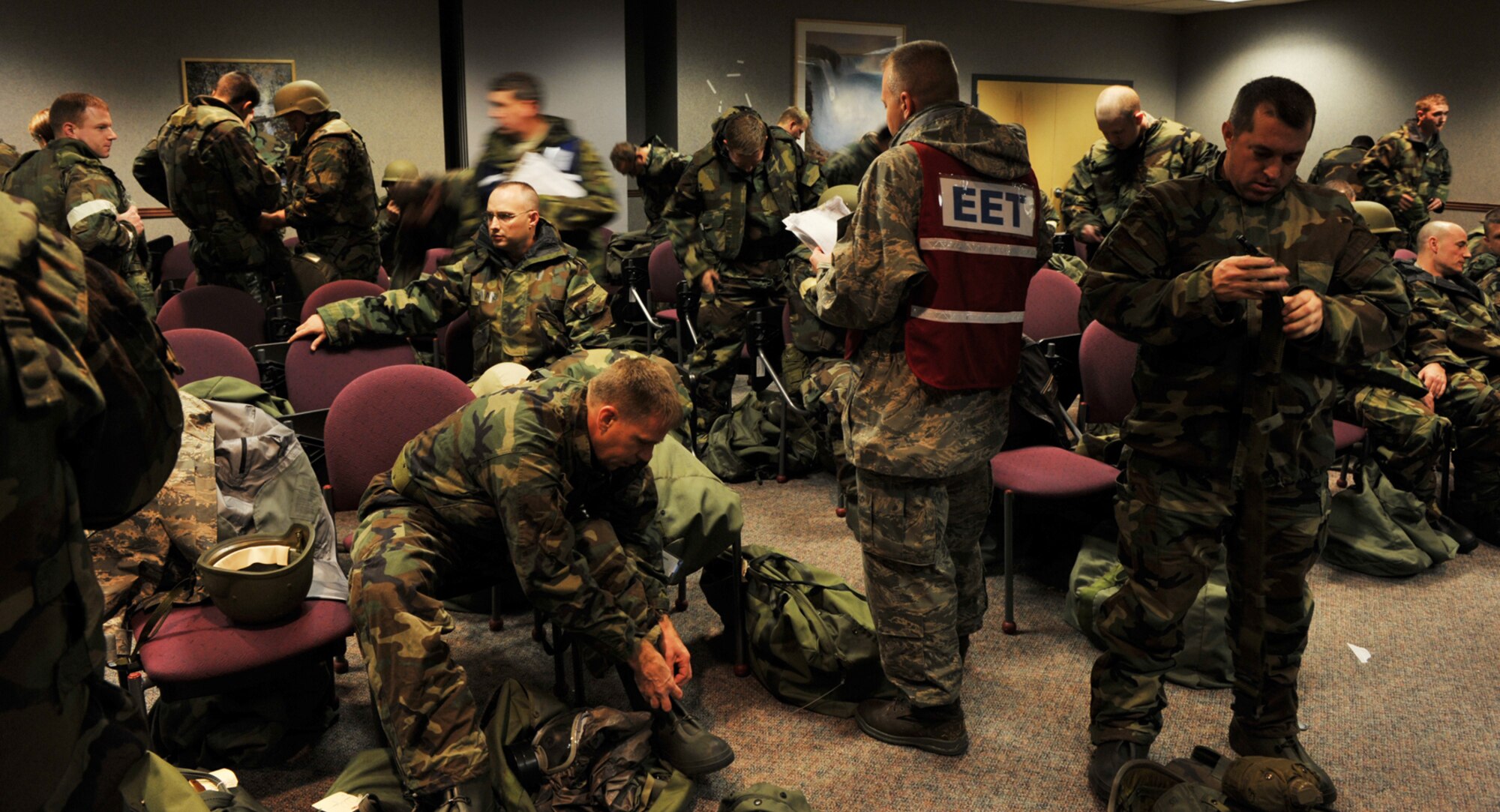 Capt. Doug Crow takes roll while 931st Air Refueling Group members prepare to start Ability-To-Survive-and-Operate training at McConnell Air Force Base, Kan., on Nov. 15. Captain Crow is the 931st ARG's process manager. (U.S. Air Force photo/Master Sgt. Jason Schaap)