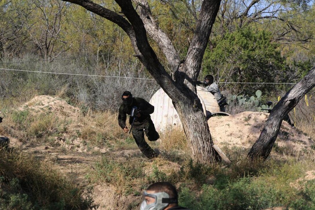 A paintball player runs for cover to avoid getting hit.  The The Texas Air National Guard's 217th Training Squadron at Goodfellow AFB hosted the  the 3rd-annual charity paintball tournament in
San Angelo to benefit the Special Operations Warrior Foundation.  The event involved apporximately 200 civilian, Army, Navy, Air Force, Marnine and Air National Guard personnel and their families.  (U.S. Air Force photo by Mr Tony Lynch)
