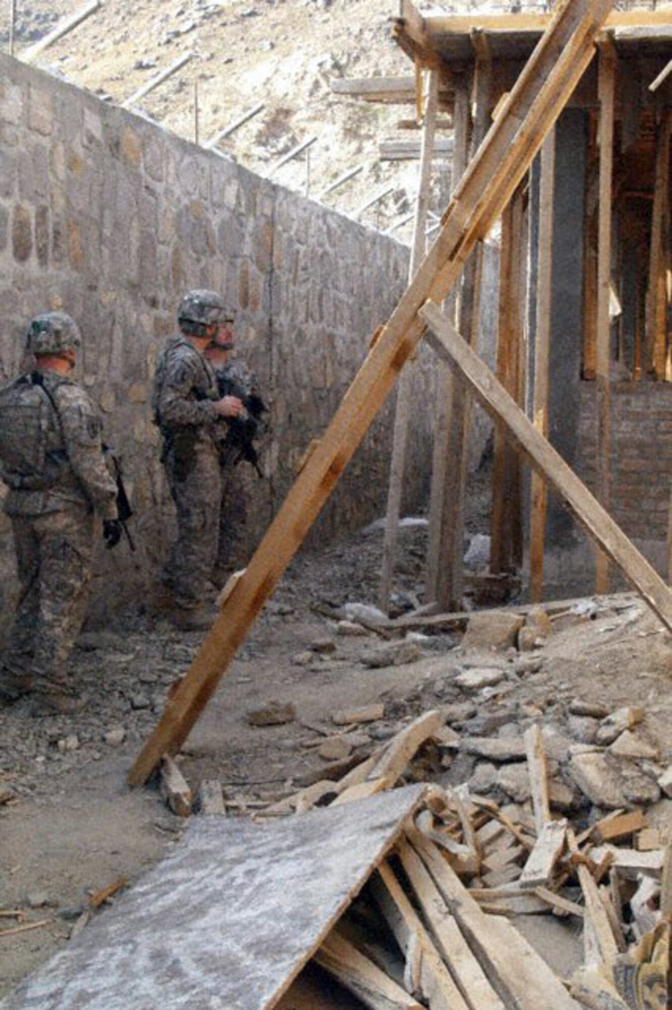 Kunar Provincial Reconstruction Team leaders and engineers inspect construction on the Kunar Prison Oct. 29, 2009, in the Kunar Province, Afghanistan. Correctional experts and PRT leaders and engineers visited the prison construction site to conduct a quality assurance check and address potential security concerns. (U.S. Air Force photo/Capt. Tony Wickman)
