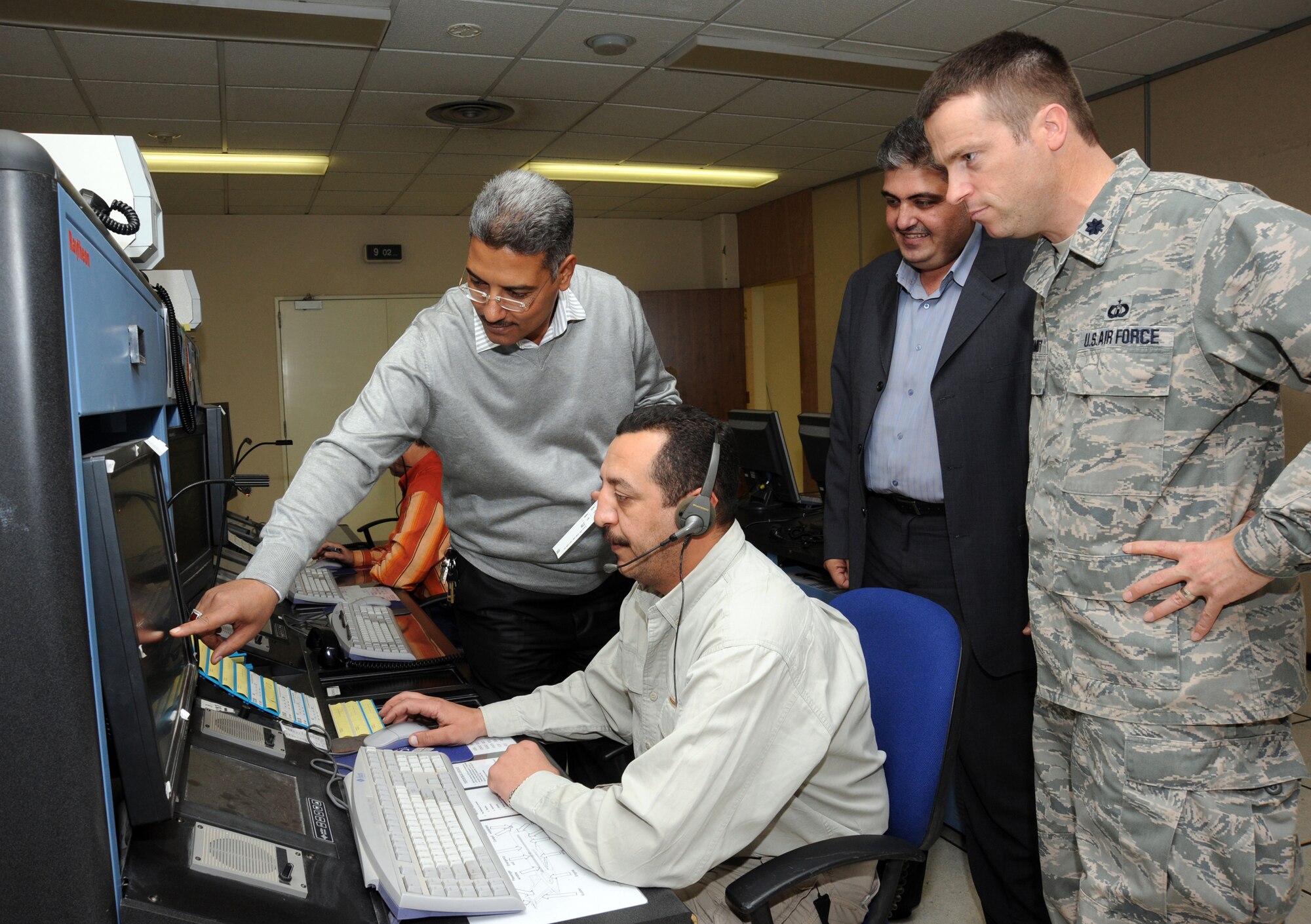 Iraqi Civil Aviation Authority members discuss the new airway structure Nov. 18, 2009. Air Force members spent seven months assisting the Iraqis with developing new air routes. These routes will increase efficiency and capacity through Iraqi airspace allowing the country to normalize airspace and increase air traffic. (U.S. Air Force photo/Tech. Sgt. Johnny L. Saldivar)