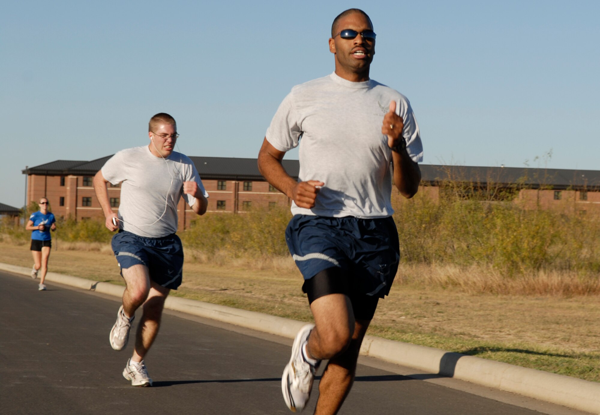 GOODFELLOW AIR FORCE BASE, Texas -- Airman 1st Class Chadwick McGuire, 17th Training Support Squadron, crosses the finish line after completing the 2009 Turkey Trot 5 kilometer course, Nov. 18. Airman McGuire took first place in the men's category with a time of 15 minutes, six seconds. (U.S. Air Force photo/Lou Czarnecki)