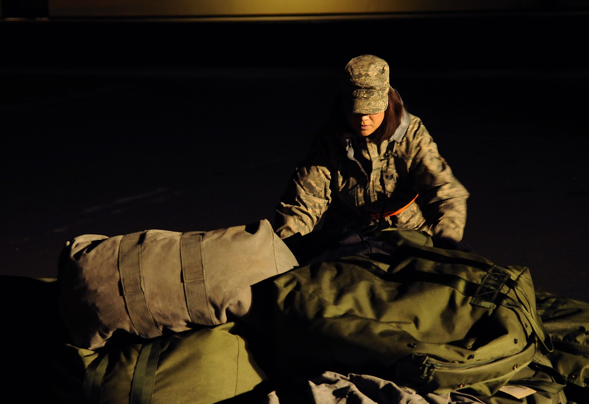 SPANGDAHLEM AIR BASE, Germany -- Staff Sgt. Melinda Reyes, 52nd Logistics Readiness Squadron, organizes mobility bags on a pallet here Nov. 19. The 52nd Fighter Wing conducted a Phase I exercise to evaluate readiness and prepare for a NATO tactical evaluation scheduled for June 2010. (U.S. Air Force photo/Airman 1st Class Nathanael Callon)