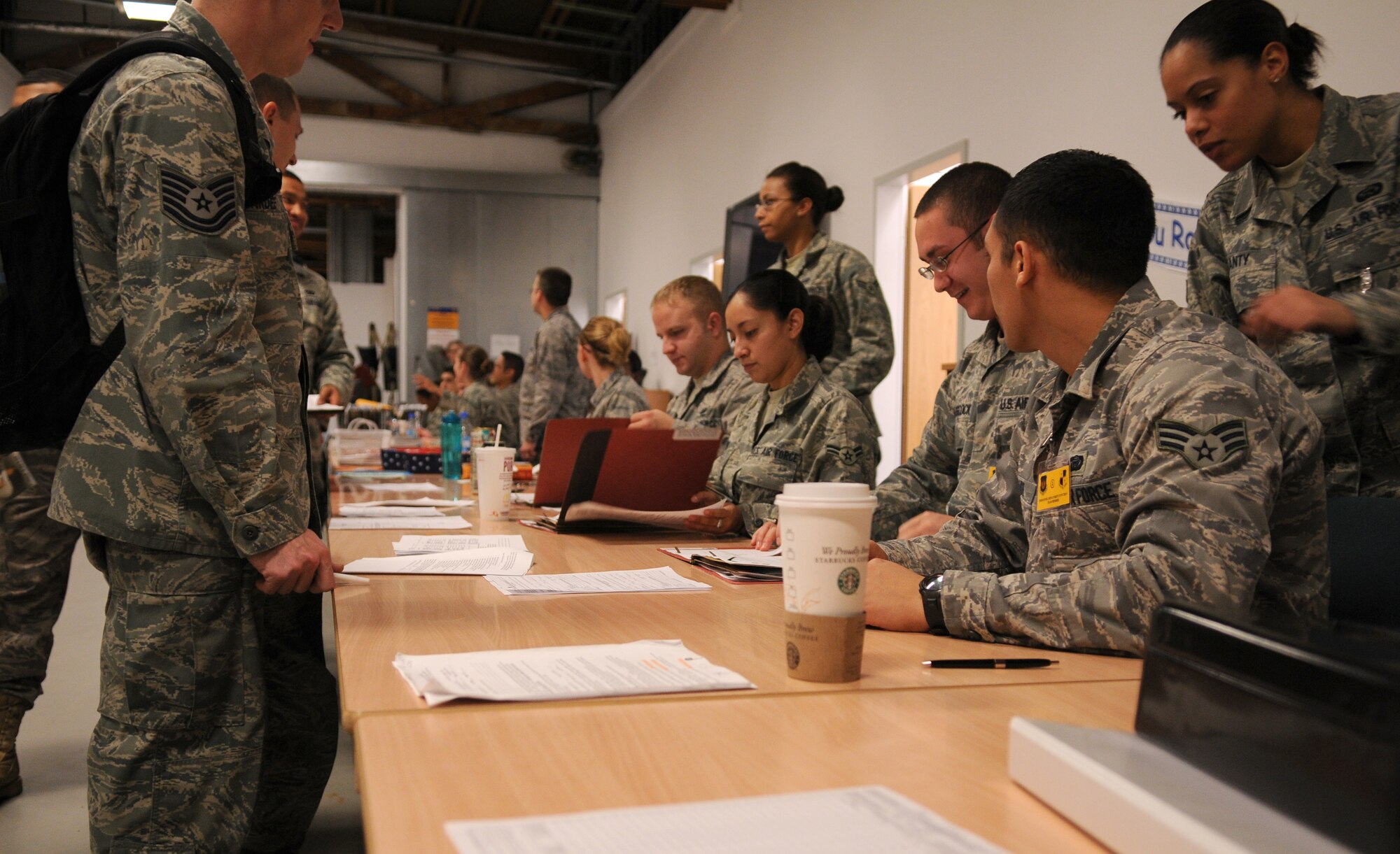 SPANGDAHLEM AIR BASE, Germany -- Deployers from the 52nd Fighter Wing process through a personnel deployment function line here Nov. 19. This exercise focused on personnel deployment function lines, emergency management and overall timeliness in responding to mission necessity. (U.S. Air Force photo/Airman 1st Class Nathanael Callon)