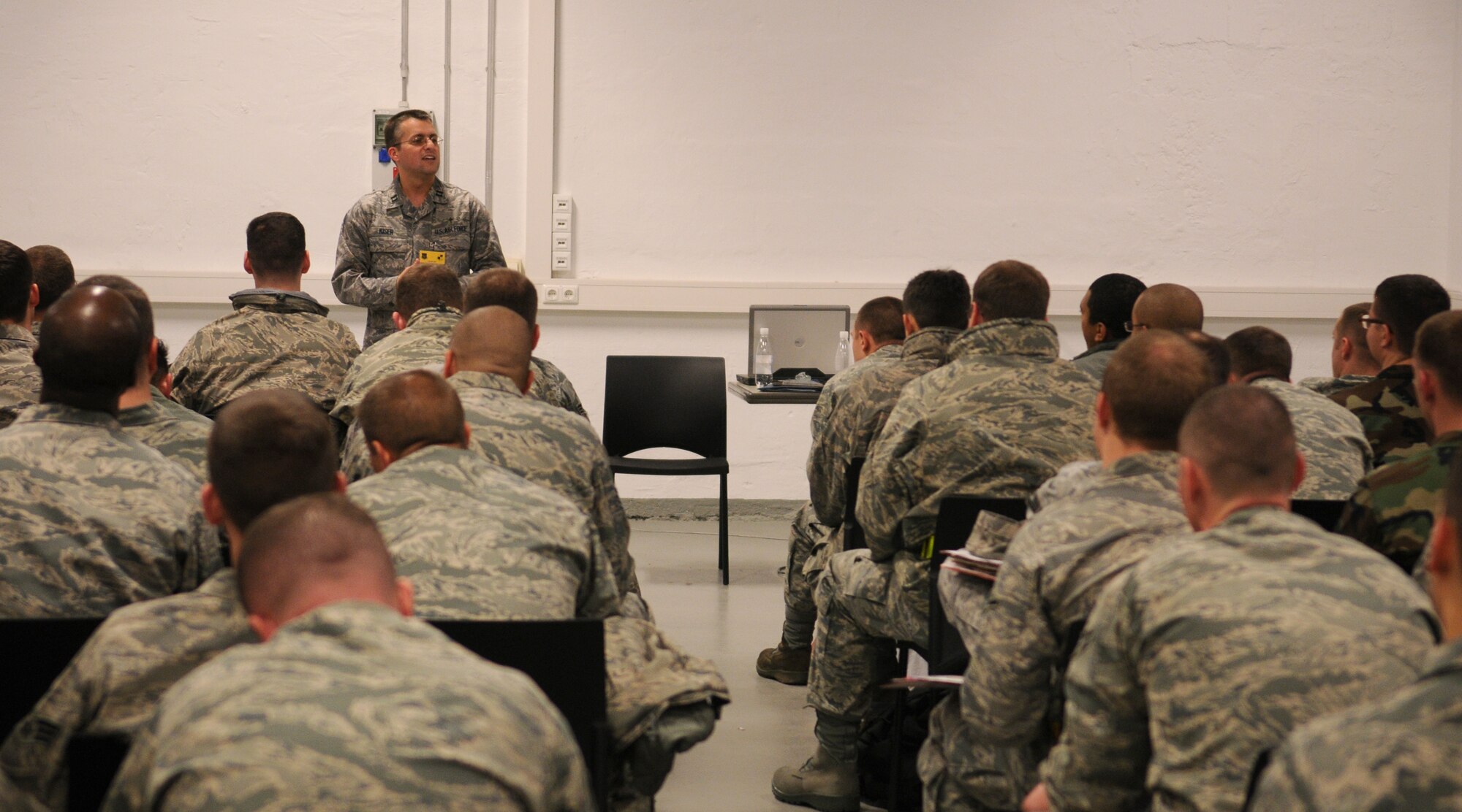 SPANGDAHLEM AIR BASE, Germany -- Chaplain (Capt.) Ronald Kiser, 52nd Fighter Wing chaplain, briefs deployers during the personnel deployment function here Nov. 19. This exercise focused on personnel deployment function lines, emergency management and overall timeliness in responding to mission necessity. (U.S. Air Force photo/Airman 1st Class Nathanael Callon)