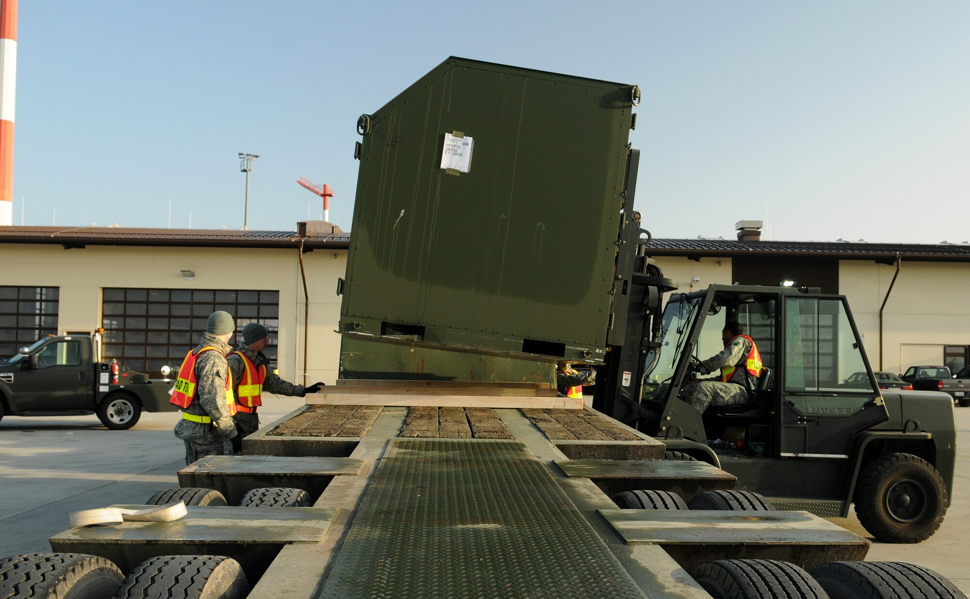SPANGDAHLEM AIR BASE, Germany -- Members of the 52nd Fighter Wing load cargo on to a semi trailer during Operation Saber Crown 10-02 Nov. 20 here. The exercise provided critical information for the readiness of the 52nd Fighter Wing. (U.S. Air Force photo/Airman 1st Class Nathanael Callon)