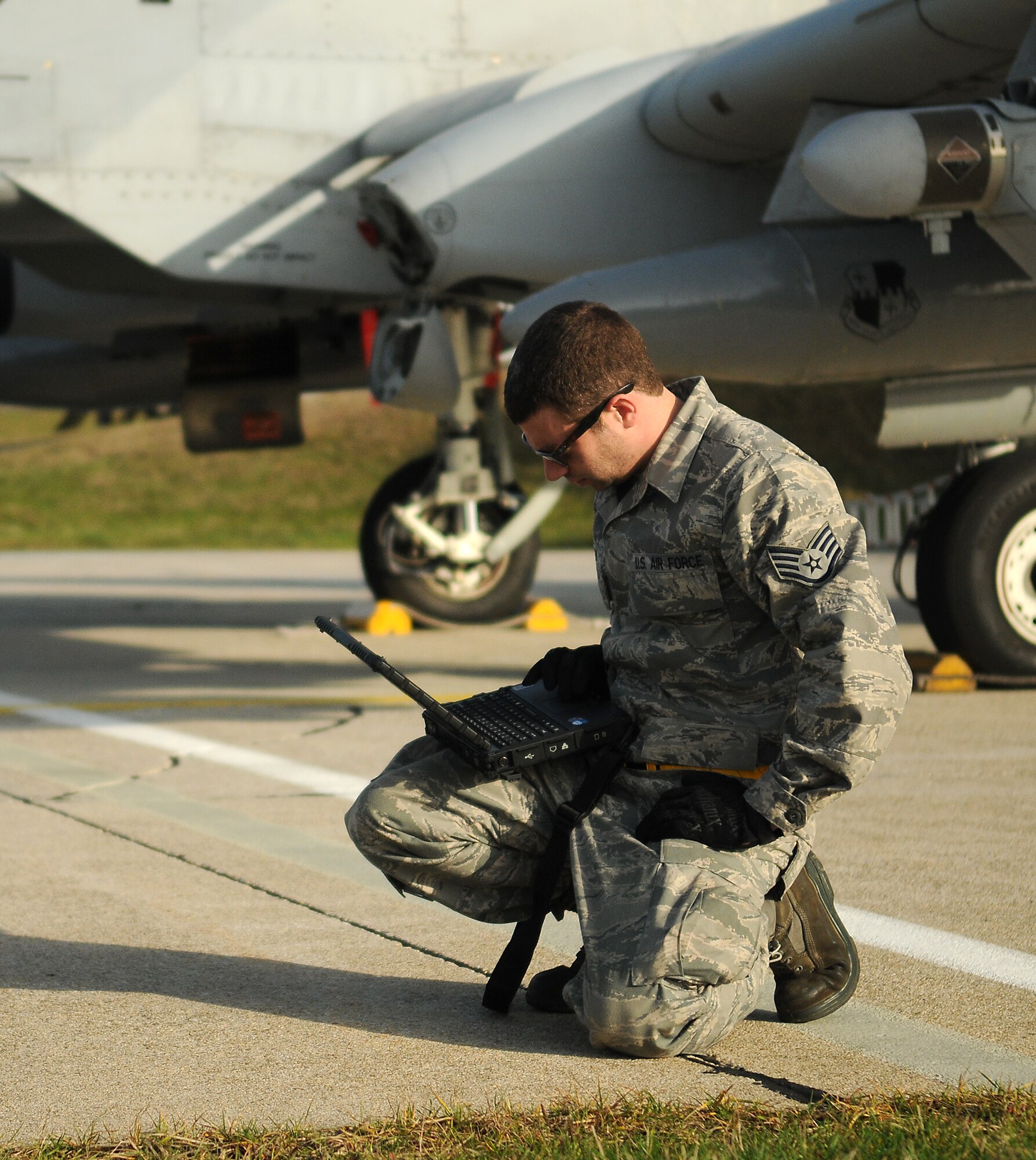 SPANGDAHLEM AIR BASE, Germany -- Staff Sgt. Joseph Daly, 52nd Aircraft Maintenance Squadron, reviews information on a computer during a post-flight inspection of an 81st Fighter Squadron A-10 Thunderbolt II Nov. 20 here. The aircraft was part of a six-ship formation that took part in Operation Saber Crown 10-02. (U.S. Air Force photo/Airman 1st Class Nathanael Callon)