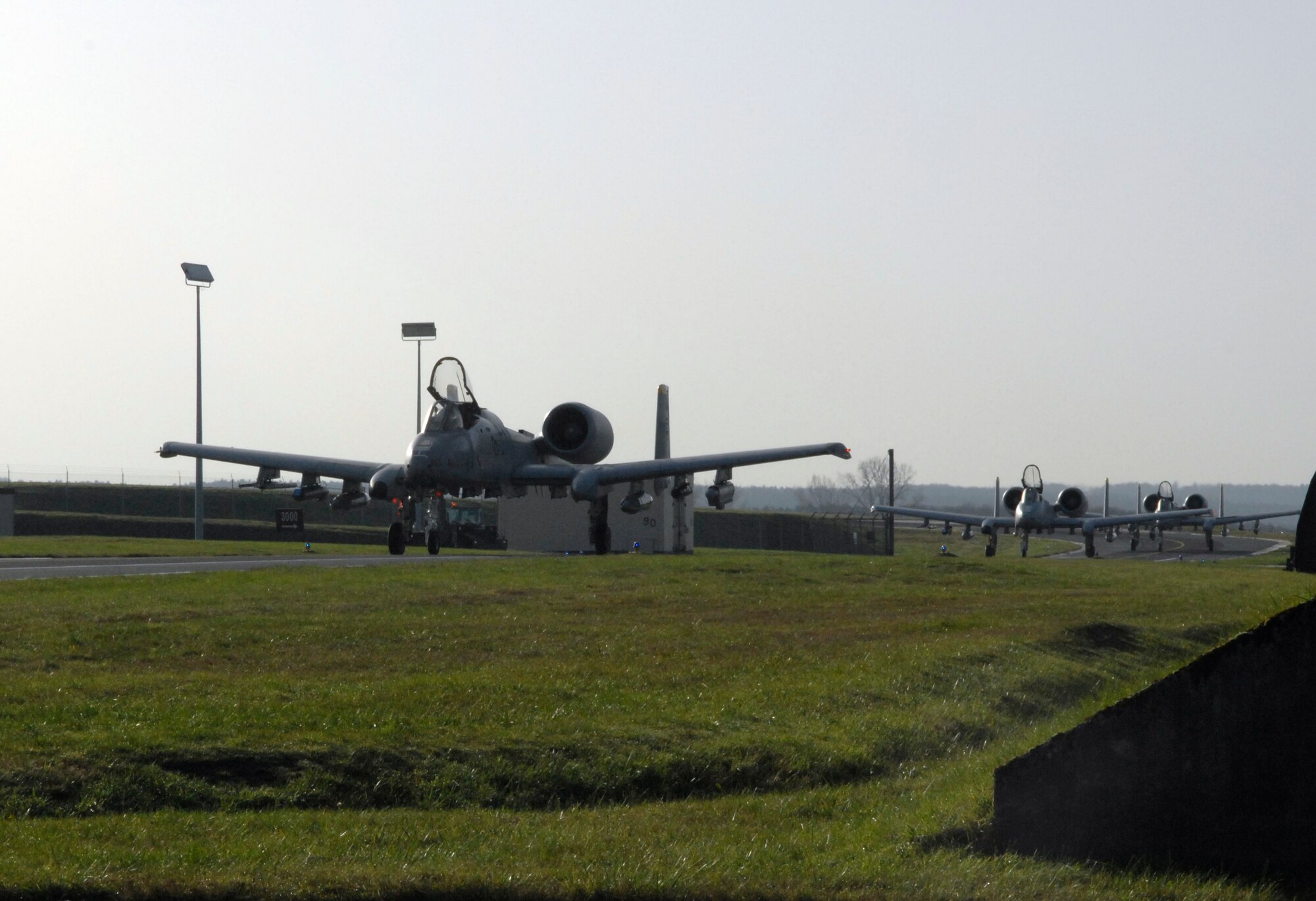 SPANGDHALEM AIR BASE, Germany – Three A-10 Thunderbolt IIs taxi toward the hardened aircraft shelters here Nov. 20. The A-10s joined with three others to form a six-ship aircraft formation that flew to a simulated deployed location during Operation Saber Crown 10-02. (U.S. Air Force photo/Senior Airman Kali L. Gradishar)