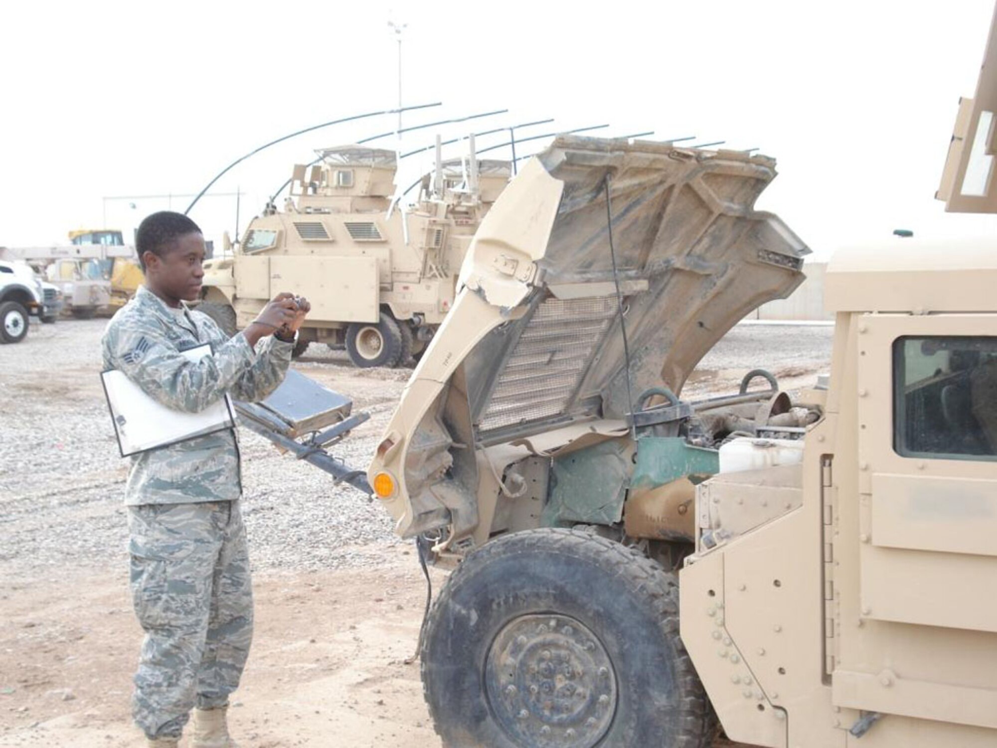 Senior Airman Joseph Herard, 375th Logistics Readiness Squadron, deployed to Iraq, is responsible for maintaining the vehicle data there and resolves any computer processing problems while preparing vehicle historical records. He also documents any vehicle accident or abuse reports and documents battle damages to the fleet. (Courtesy Photo) 