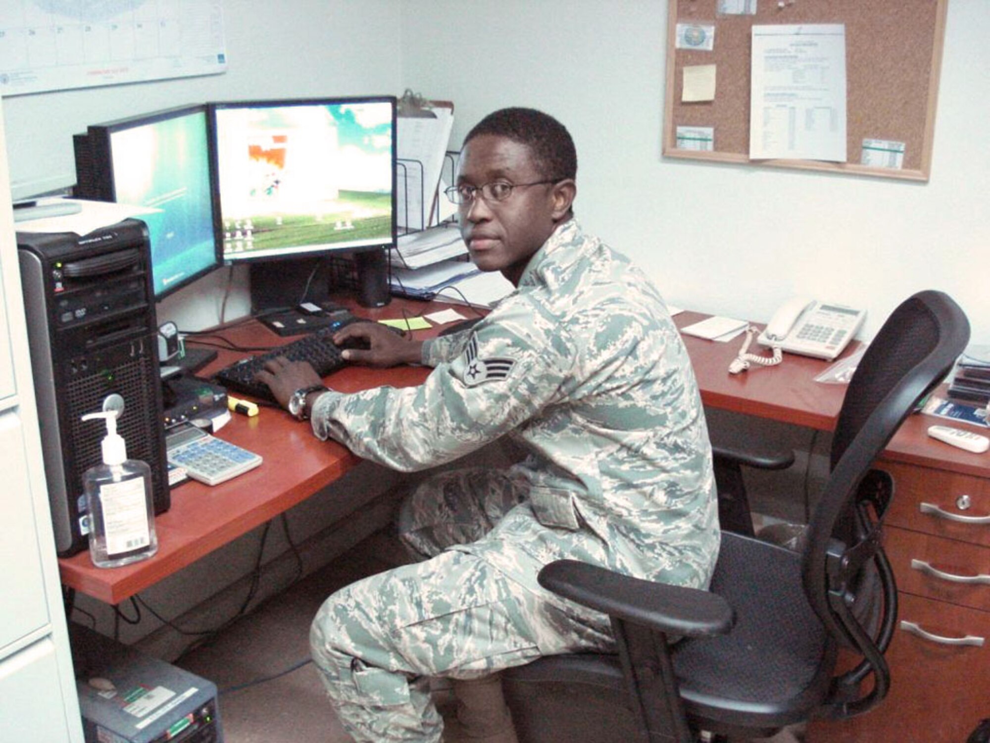 Senior Airman Joseph Herard, 375th Logistics Readiness Squadron, deployed to Iraq, is responsible for maintaining the vehicle data there and resolves any computer processing problems while preparing vehicle historical records. He also documents any vehicle accident or abuse reports and documents battle damages to the fleet. (Courtesy Photo)
