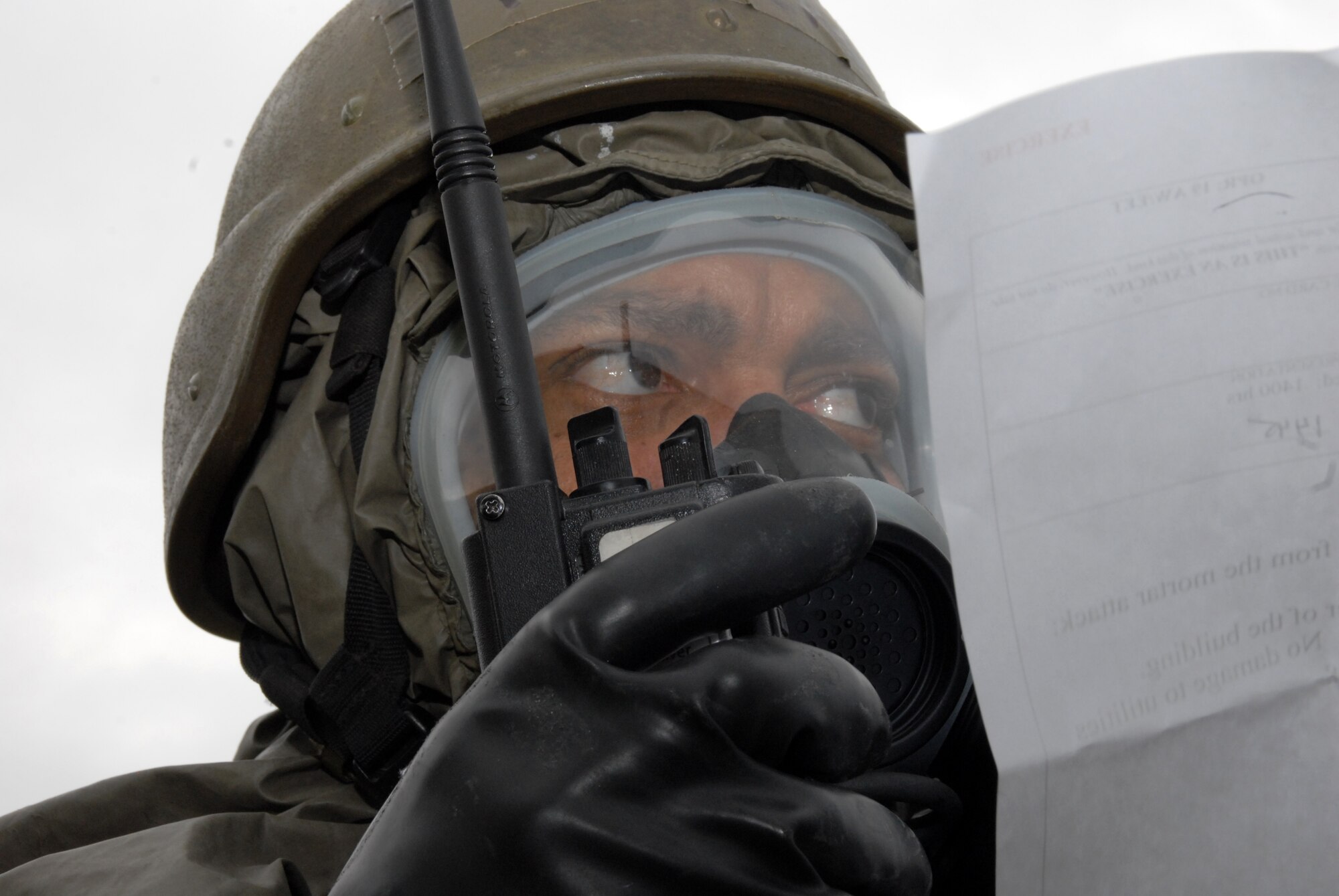 Master Sgt. Carl Hendricks, 19th Equipment Maintenance Squadron aerospace ground equipment craftsman, uses a radio to call in a simulated unexploded ordinance discovered during a post attack reconnaissance sweep, after being attacked during a base exercise Nov. 17. (U.S. Air Force photo by Senior Airman Michael Watkins)