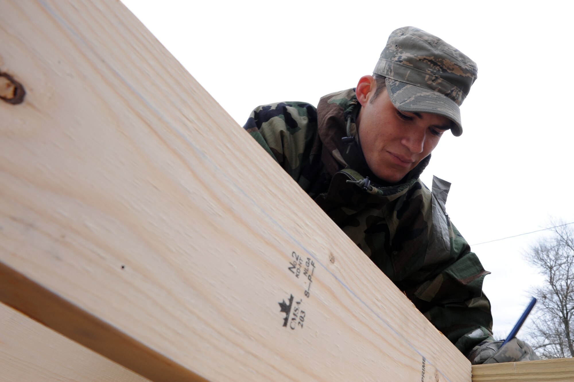 Airman 1st Class Raleigh Gosdin, 19th Civil Engineer Squadron structural apprentice, marks a lookout for the roofing system for new restrooms at the base lake Nov. 17. (U.S. Air Force photo by Senior Airman Ethan Morgan)