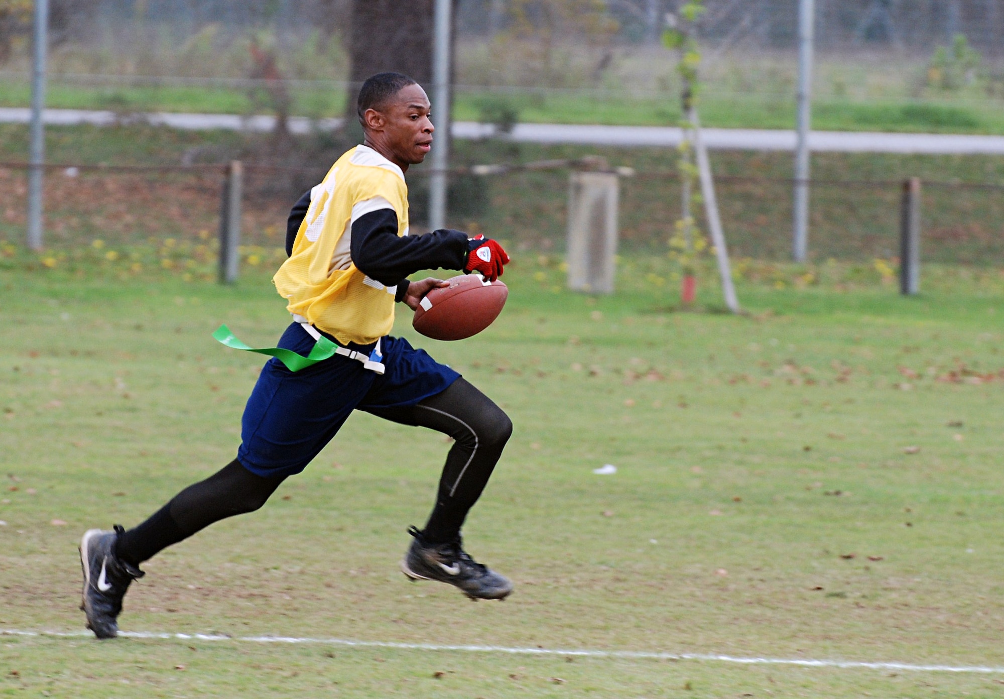 CAMP DARBY, Italy -- Tech. Sgt. Mike Jackson, 52nd Aircraft Maintenance Squadron, runs the ball downfield for a touchdown during the first U.S. Air Forces in Europe flag football championship in Camp Darby, Italy, held Nov. 12-16. The Spangdahlem Air Base team tied for the best record, but came in third place overall. (U.S. Army photo/Joyce Costello)