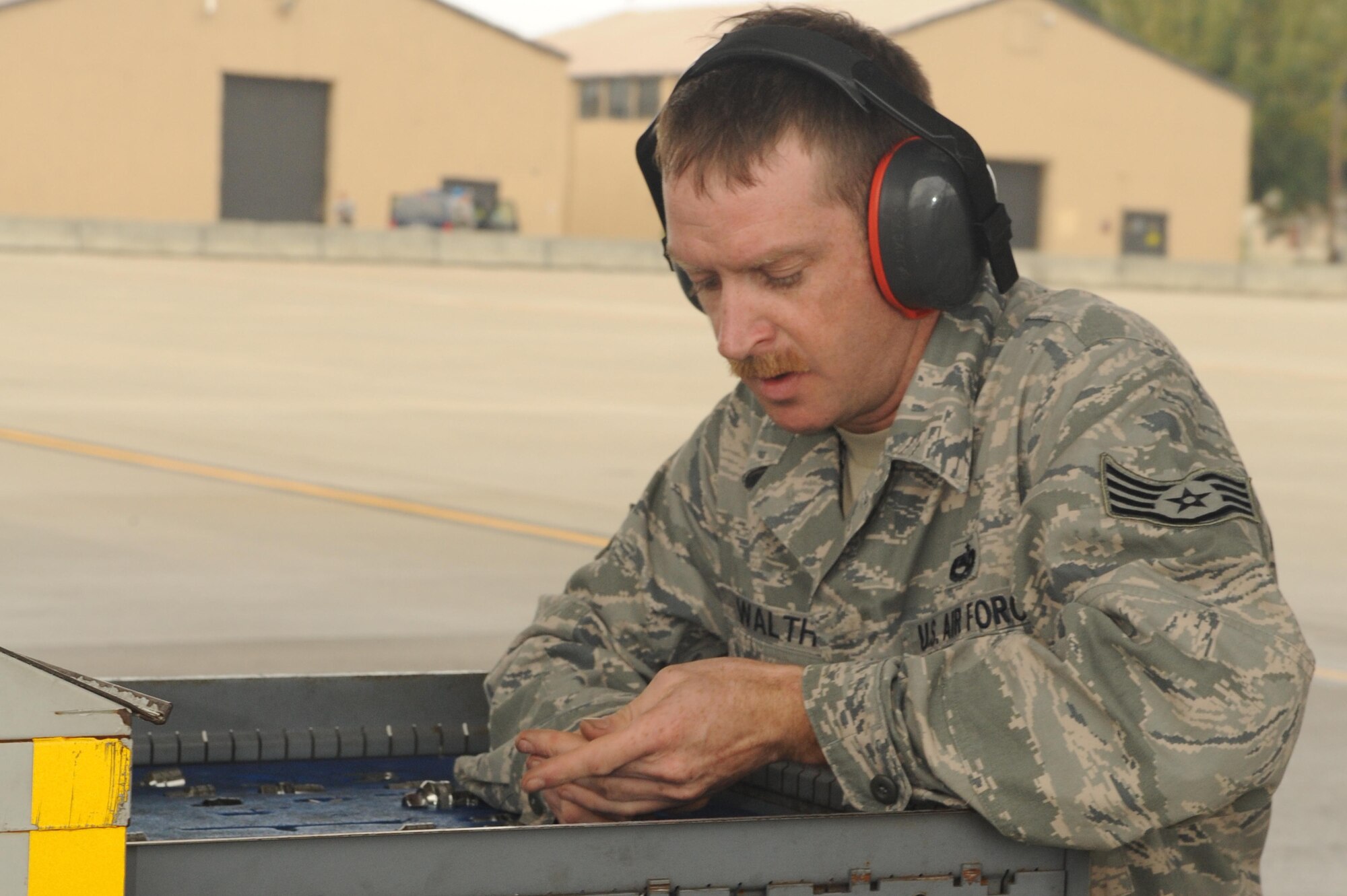 SHAW AIR FORCE BASE, S.C. -- Staff Sgt. Chad Walth, 20th Aircraft Maintenance Squadron, and an F-16 crew chief, goes through his list of tools during alert exercise Fertile Keynote Nov. 19. The exercise was conducted by 20th Fighter Wing plans and inspections to prepare alert Airmen for an upcoming inspection by higher headquarters. Shaw's alert mission is part of Operation Noble Eagle, a quick-response operation that protects U.S. airspace, and supports significant events like presidential movements and space shuttle launches. (U.S. Air Force photo/Senior Airman David Minor)
