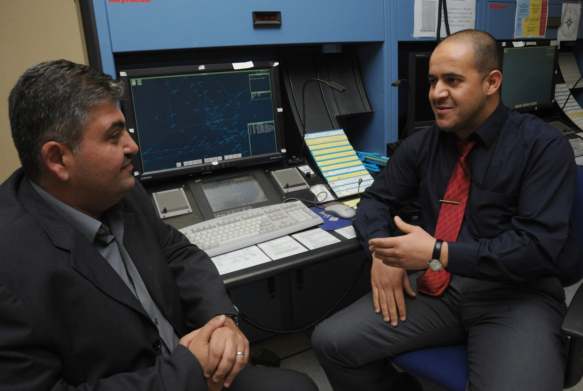 BAHGDAD -- Iraqi Civil Aviation Authority members discuss the new airway structure Nov. 18, 2009. Air Force members spent seven months assisting the Iraqis with developing new air routes. These routes will increase efficiency and capacity through Iraqi airspace allowing the country to normalize airspace and increase air traffic. (U.S. Air Force photo/Tech. Sgt. Johnny L. Saldivar)