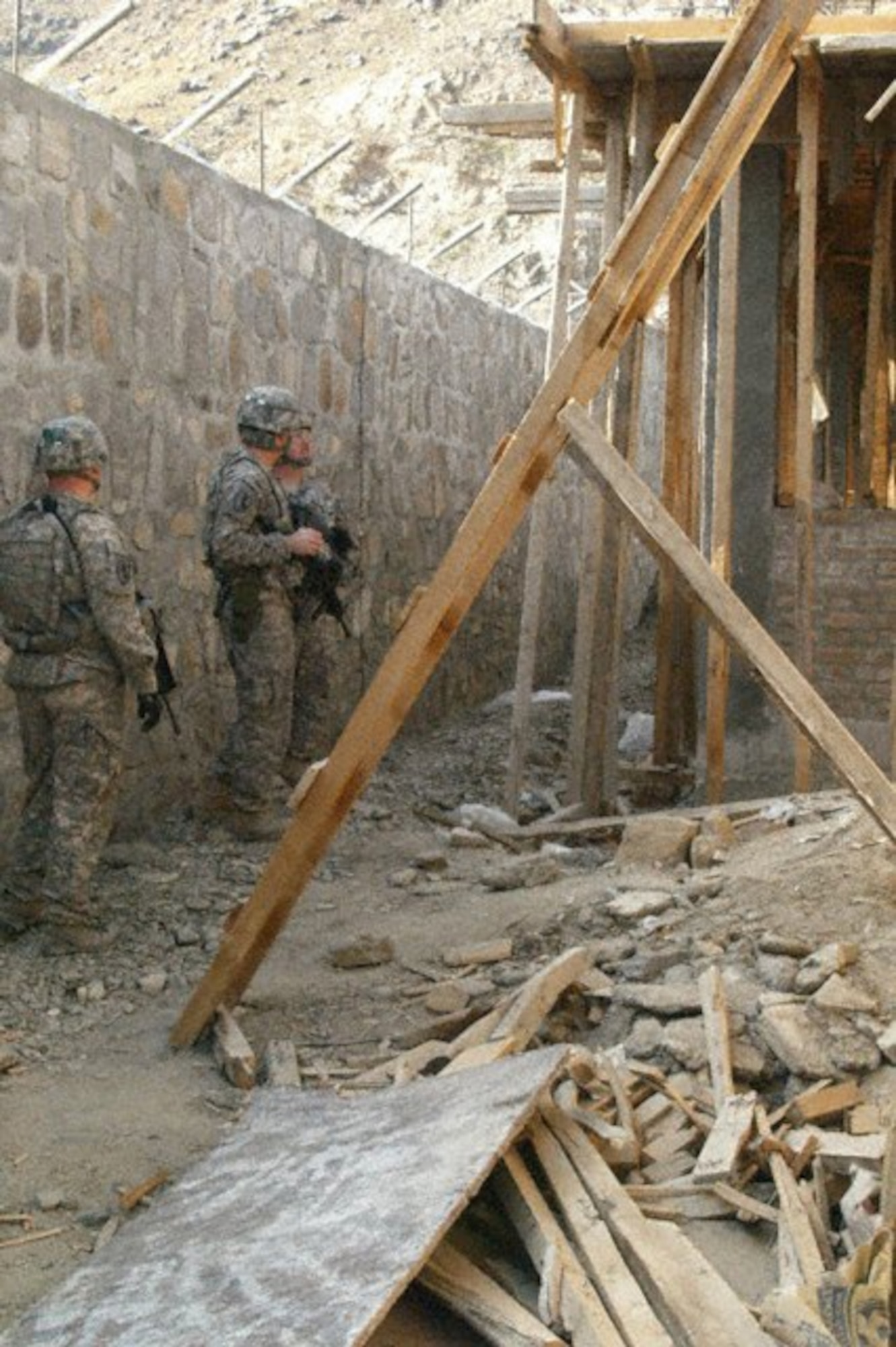 KUNAR PROVINCE, Afghanistan -- Kunar Provincial Reconstruction Team leaders and engineers inspect construction on the Kunar Prison recently. Correctional experts and PRT leaders and engineers visited the prison construction site to conduct a quality assurance check and address potential security concerns. The site visit was coordinated with Task Force Mountain Warrior's rule of law office to enhance the cooperation and understanding between the host nation, the U.S. military and other agencies involved in the development and governance of Afghanistan. (U.S. Air Force photo/Capt. Tony Wickman) 