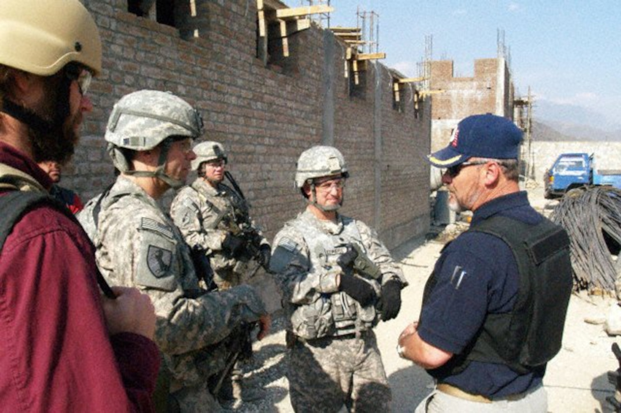 KUNAR PROVINCE, Afghanistan -- Del Moad, Corrections System Support Program team leader, discusses prison security operations and construction requirements with Kunar Provincial Reconstruction Team leaders and engineers during a site visit to the Kunar Prison construction site. Correctional experts and PRT leaders and engineers visited the prison construction site to conduct a quality assurance check and address potential security concerns. The site visit was coordinated with Task Force Mountain Warrior's rule of law office to enhance the cooperation and understanding between the host nation, the U.S. military and other agencies involved in the development and governance of Afghanistan. (U.S. Air Force photo/Capt. Tony Wickman) 