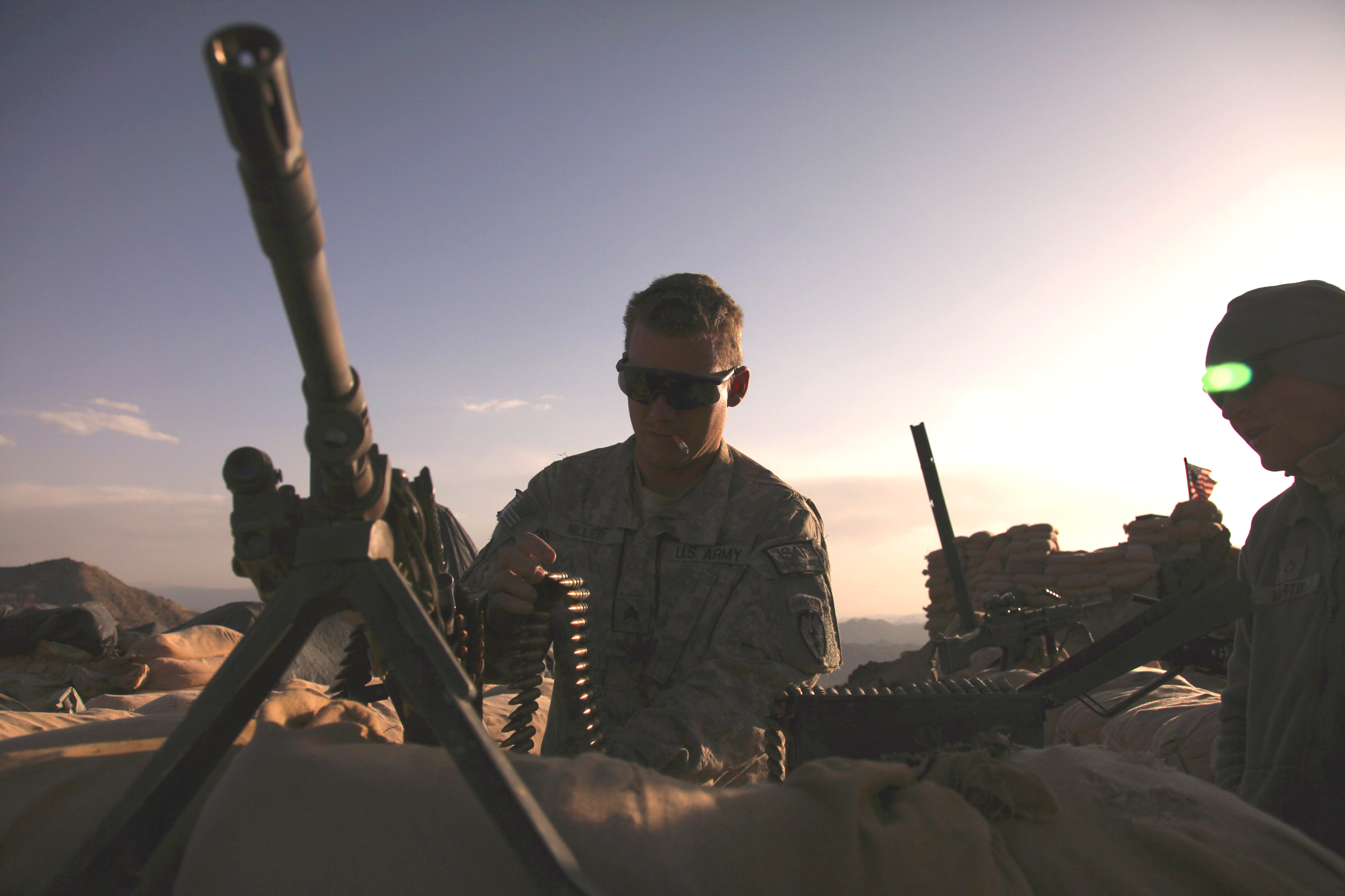 U s army sgt jory miller prepares his m 240 machine gun for a test