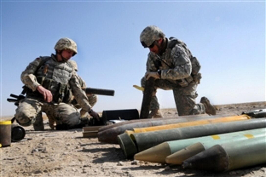 U.S. Air Force Sgt. 1st Class Jeff Truex and a Polish combat engineer open containers of faulty rockets at an undisclosed location in Ghazni province, Afghanistan, Nov. 17, 2009.  The team detonated more than 400 pounds of munitions from various sources, including munitions turned in from locals, parts of improvised explosive devices that could not be blown up in place and faulty rockets that did not fire properly. Both are assigned to Forward Operating Base, Ghazni.