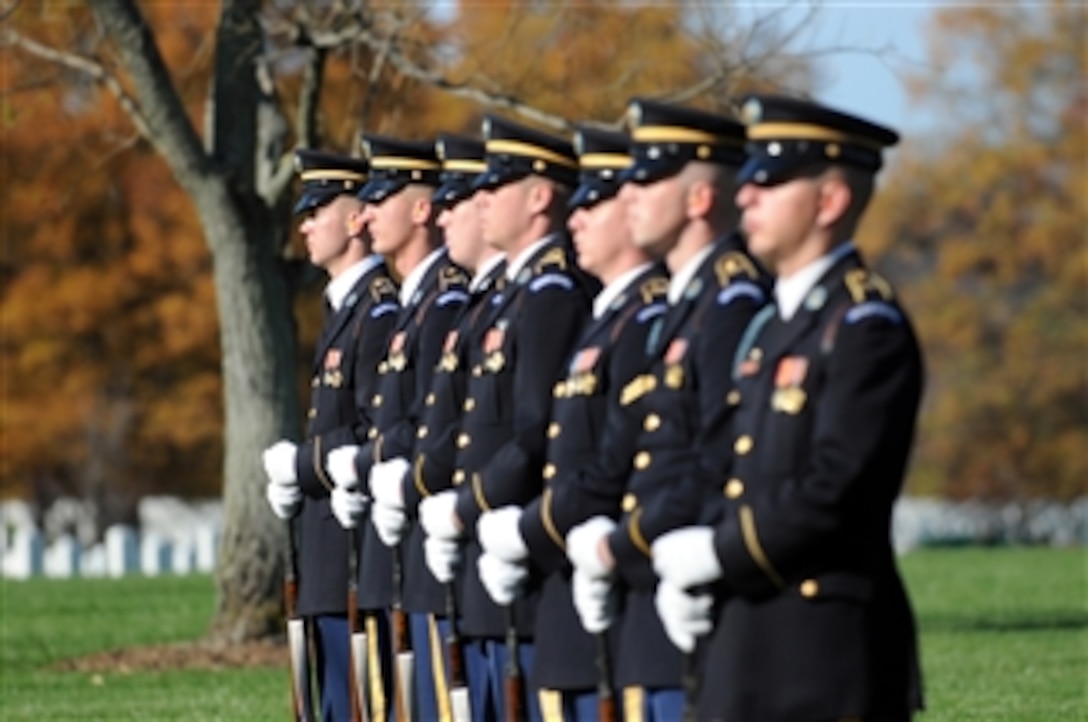 Members of the U.S. Army Ceremonial Honor Guard prepare for a 21-gun salute at Arlington National Cemetery, Va., on Nov. 17, 2009, during an interment ceremony for members of the World War II B-25 Mitchell bomber crew that was lost on Dec. 5, 1942, near Papua, New Guinea.  