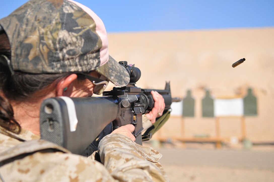 Amanda Bagnato, Marine Aircraft Group 13 spouse, shoots at a target 25 yards away with an M-16A4 service rifle at the rifle range of the Marine Corps Air Station in Yuma, Ariz., during Marine Attack Squadron 311’s Jane Wayne day Nov. 20, 2009. Jane Wayne days allow family members to experience the cornerstones of Marine training and conditioning, such as physical training and weapons handling. The family members got a taste of the Marine Corps Martial Arts Program, weapons training, obstacle course, combat fitness test and the station’s flight simulator during the squadron’s Jane Wayne day.