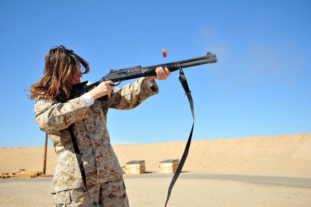 Laura Nerad, Marine Aircraft Group 13 spouse, fires an M-1014 shotgun at the rifle range of the Marine Corps Air Station in Yuma, Ariz., during Marine Attack Squadron 311’s Jane Wayne day Nov. 20, 2009. Jane Wayne days allow family members to experience the cornerstones of Marine training and conditioning, such as physical training and weapons handling. The family members got a taste of the Marine Corps Martial Arts Program, weapons training, obstacle course, combat fitness test and the station’s flight simulator during the squadron’s Jane Wayne day.