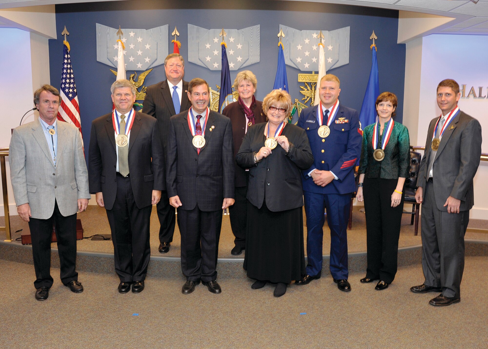 Laura Froehlich (fourth from left) stands with the 2008 Spirit of Hope awardees from the other branches of service following the ceremony at the Pentagon. Froehlich was nominated by the Navy Operational Support Center Moreno Valley and won the Navy’s Spirit of Hope Award. The Secretary of the Air Force Mr. Michael Donley (back left) and Bob Hope’s daughter, Ms. Linda Hope, presided over the ceremony.  (U.S. Air Force photo by Michael J. Pausic)
