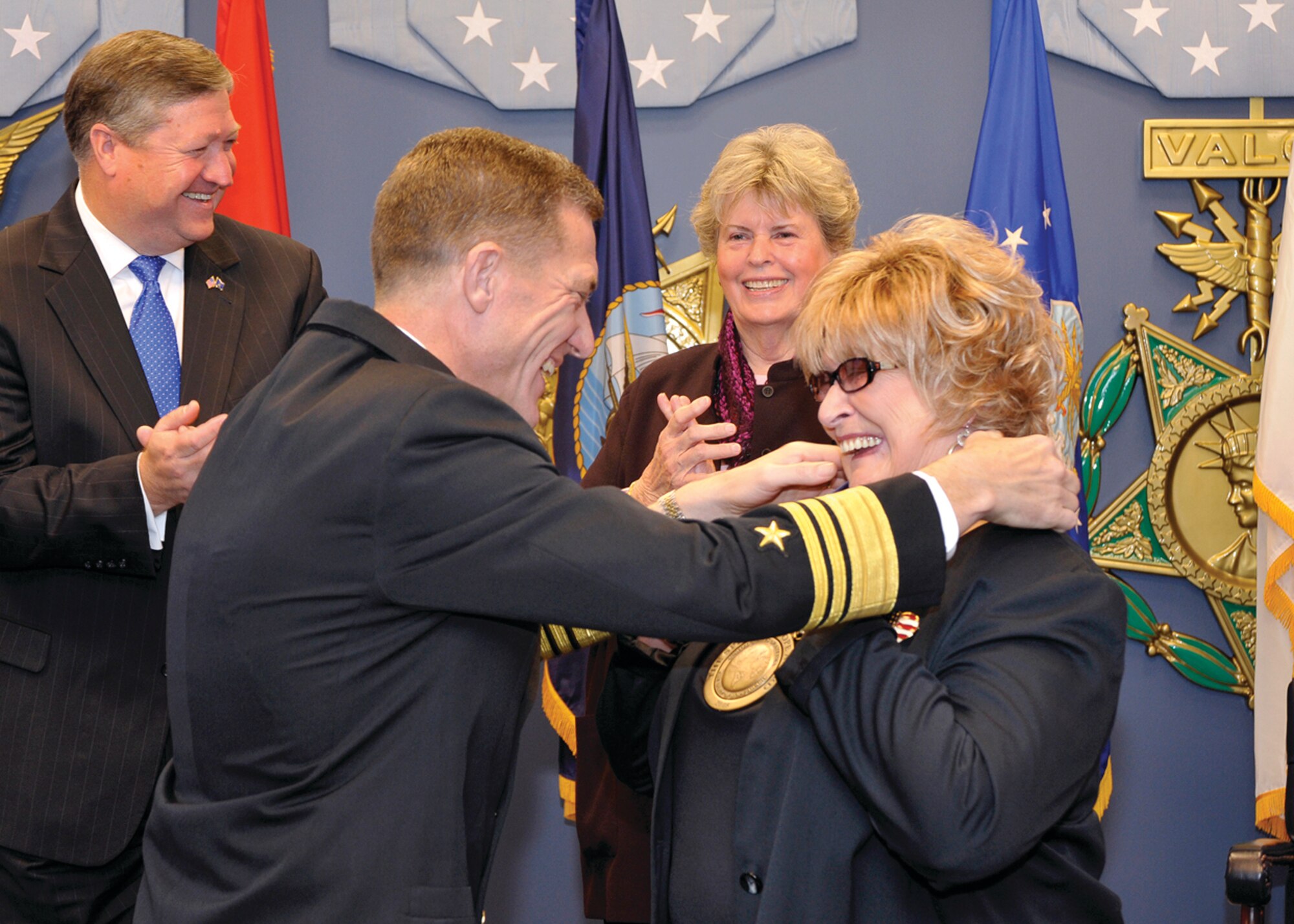 Chief of the Navy Reserve, Vice Adm. Dirk J. Debbink, presents Mrs. Laura Froehlich with the Navy’s Spirit of Hope Award in a recent ceremony at the Pentagon. Michael B. Donley (back left), Secretary of the Air Force, along with Ms. Linda Hope (back right), daughter of Bob Hope, presided over the ceremony. (U.S. Air Force photo by Michael J. Pausic)
