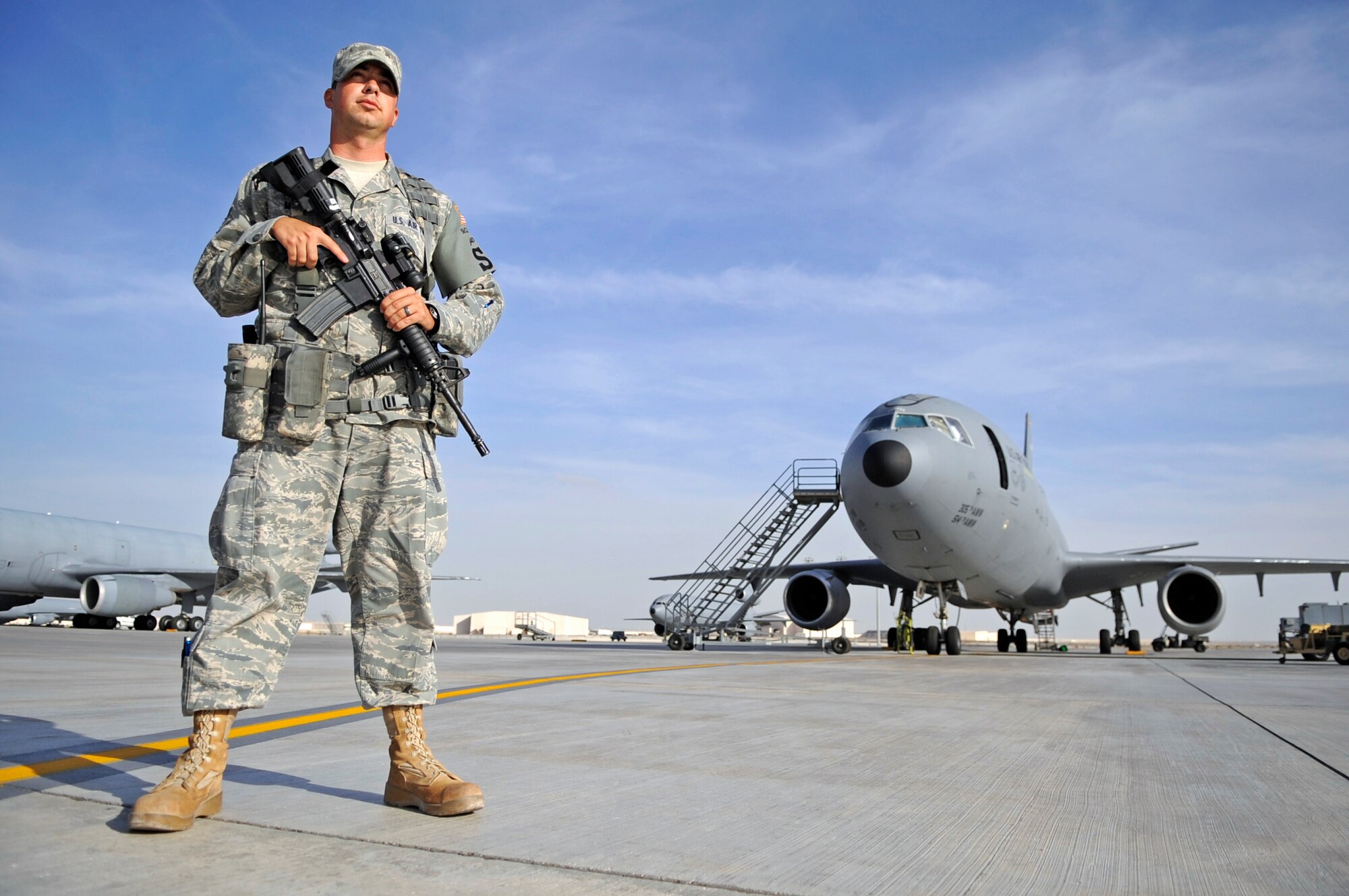 SOUTHWEST ASIA – Airman 1st Class Timothy Murphy, 380th Expeditionary Security Forces Squadron, stands guard on the flight line in front of a KC-10 Extender Nov. 21, 2009. Airman Murphy is deployed from Luke Air Force Base, Ariz., and grew up in Charleston, W.Va. (U.S. Air Force photo/Senior Airman Stephen Linch)