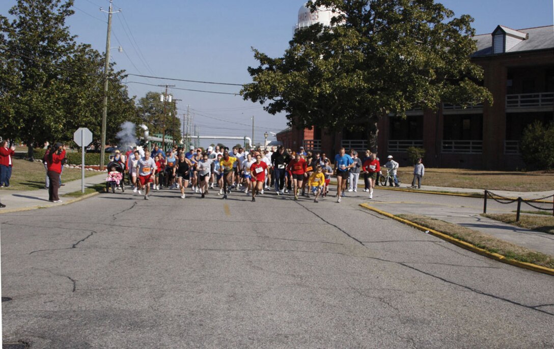 Runners take off at the sound of the gun during  the 3rd Annual Molly Marine Walk/Run at Parris Island Saturday.