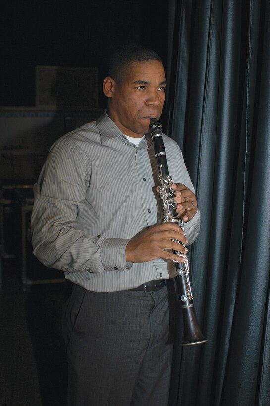 Sgt. Justin Hauser, a clarinet player in the Parris Island Marine Band, completes warm-up drills on his clarinet before a performance, Feb. 14.::n::