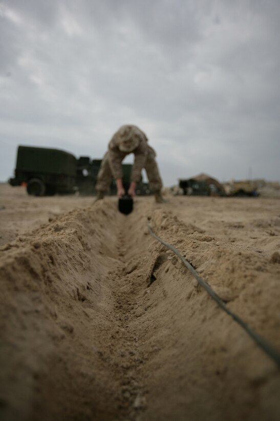 Lance Cpl. Michael W. Tupper, from Spokane, Wash., sets up a Wireless Point-to-Point Link device here while training with the 11th Marine Expeditionary Unit Nov. 21. The WPPL device was set up while members of the MEU’s Joint Task Force Enabler instructed Marines with Combat Logistics Battalion 11 and Battalion Landing Team 2/4 how to operate equipment used for enabling email, internet, and phone services.