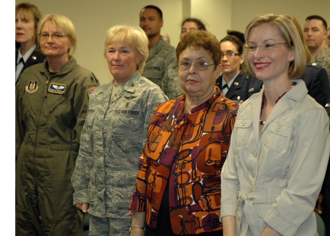 Col. Lentz's wife Dixie Reid, mother Grace Lentz, Col. Sue Milovich, Lt. Col. Rebecca Reynolds and Chief Master Sgt. Ann Hamiliton watch as he assumes command the 315th AMDS here on Sunday. (U.S. Air Force photo/Tech. Sgt. Jeff Kelly) 
