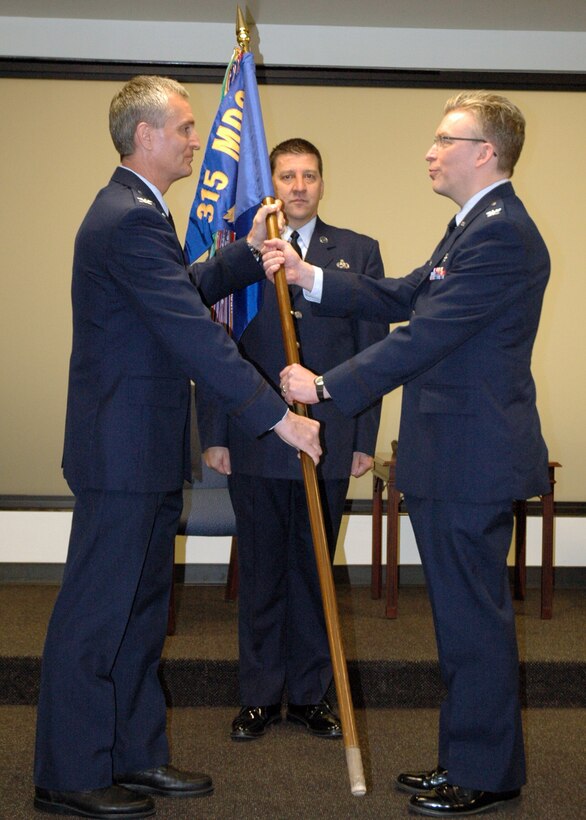 Col. Christopher W. Lentz officially assumes command of the 315th AMDS from Col. Steven Chapman, 315th Airlift Wing commander during a ceremony held Sunday.