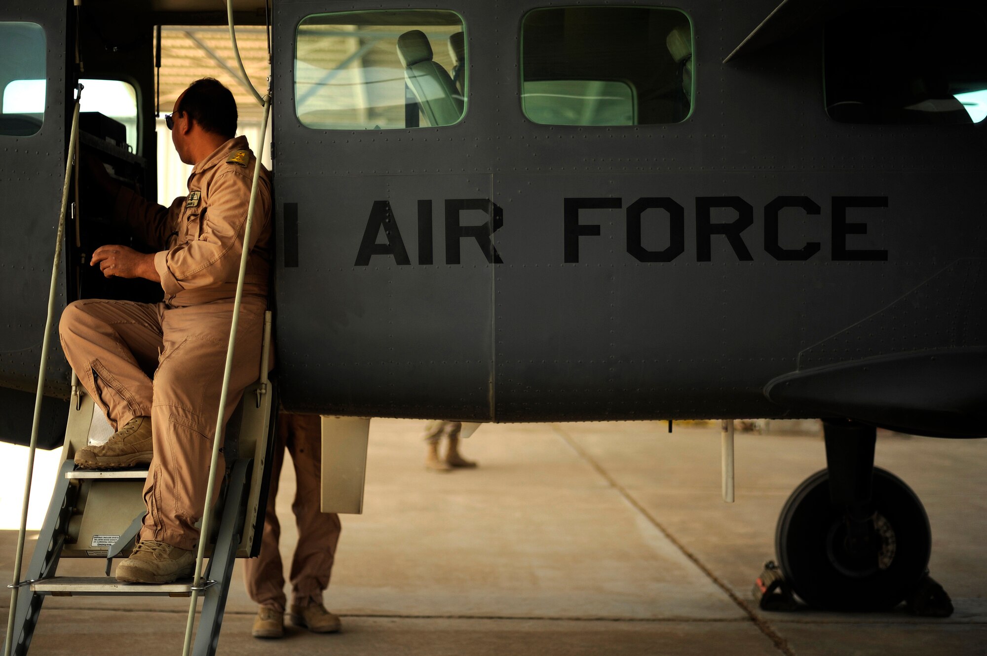 An Iraqi Air Force Airman performs a pre-flight inspection on an AC-208 from Squadron 3 at Kirkuk Air Base, Iraq, Oct. 21, 2009. (U.S. Air Force photo/Staff Sgt. Michael B. Keller) 
